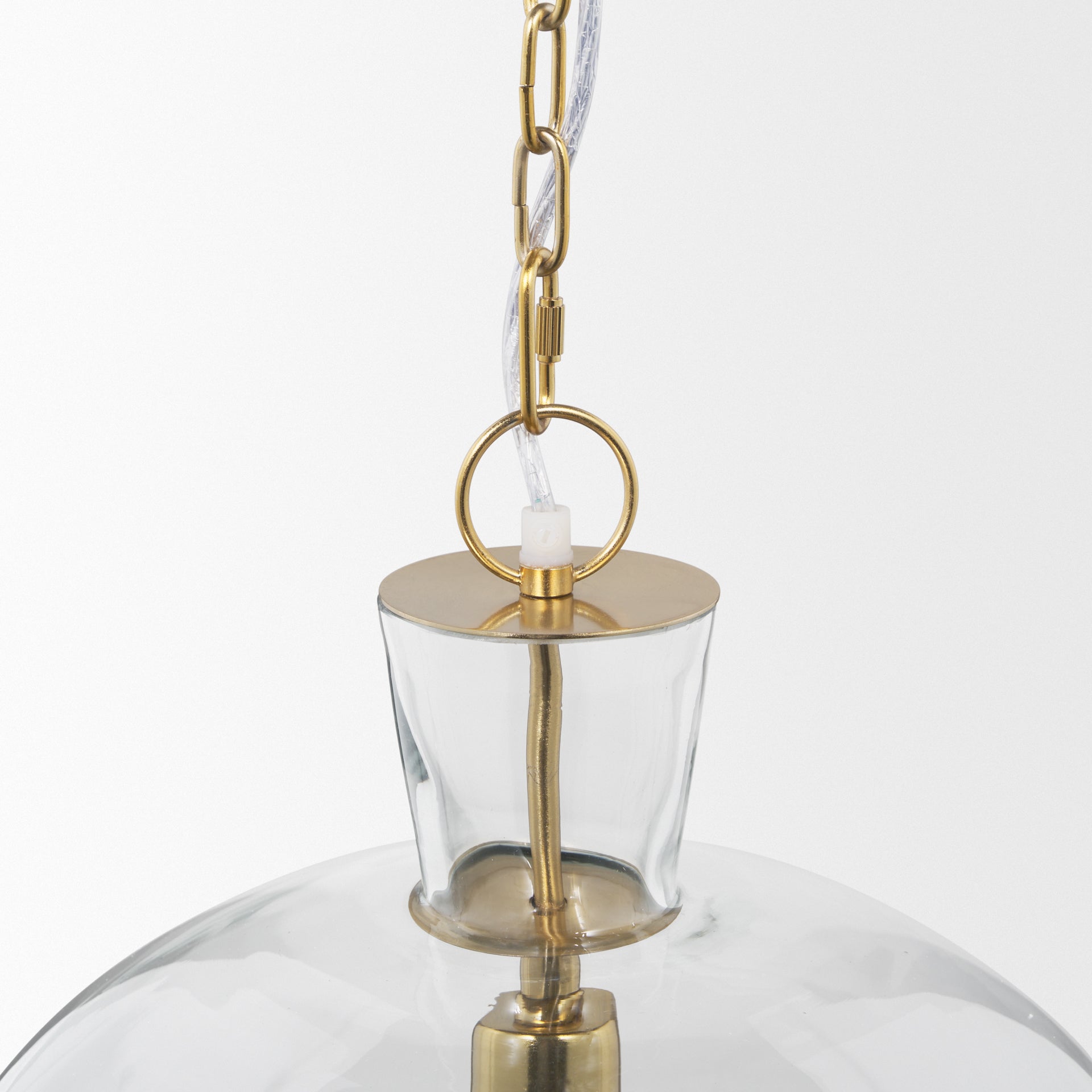 Sadah Large Clear Blown Glass w/ Gold Metal Pendant Light viewed from the side.