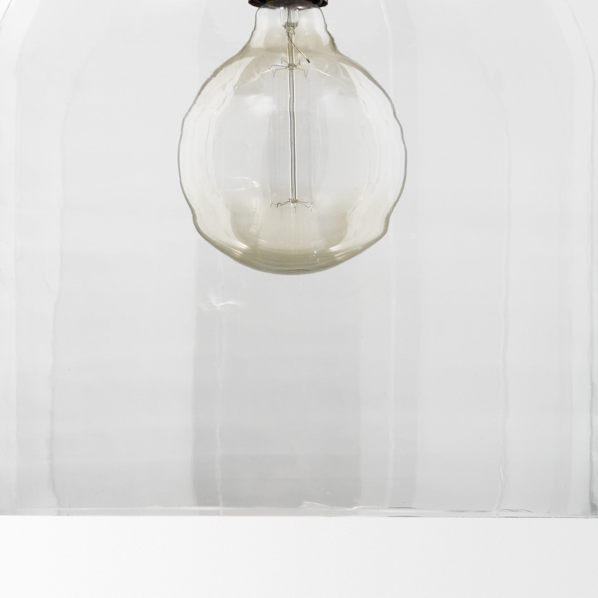 Sadah Large Clear Blown Glass w/ Gold Metal Pendant Light shown from a different angle to reveal its silhouette.