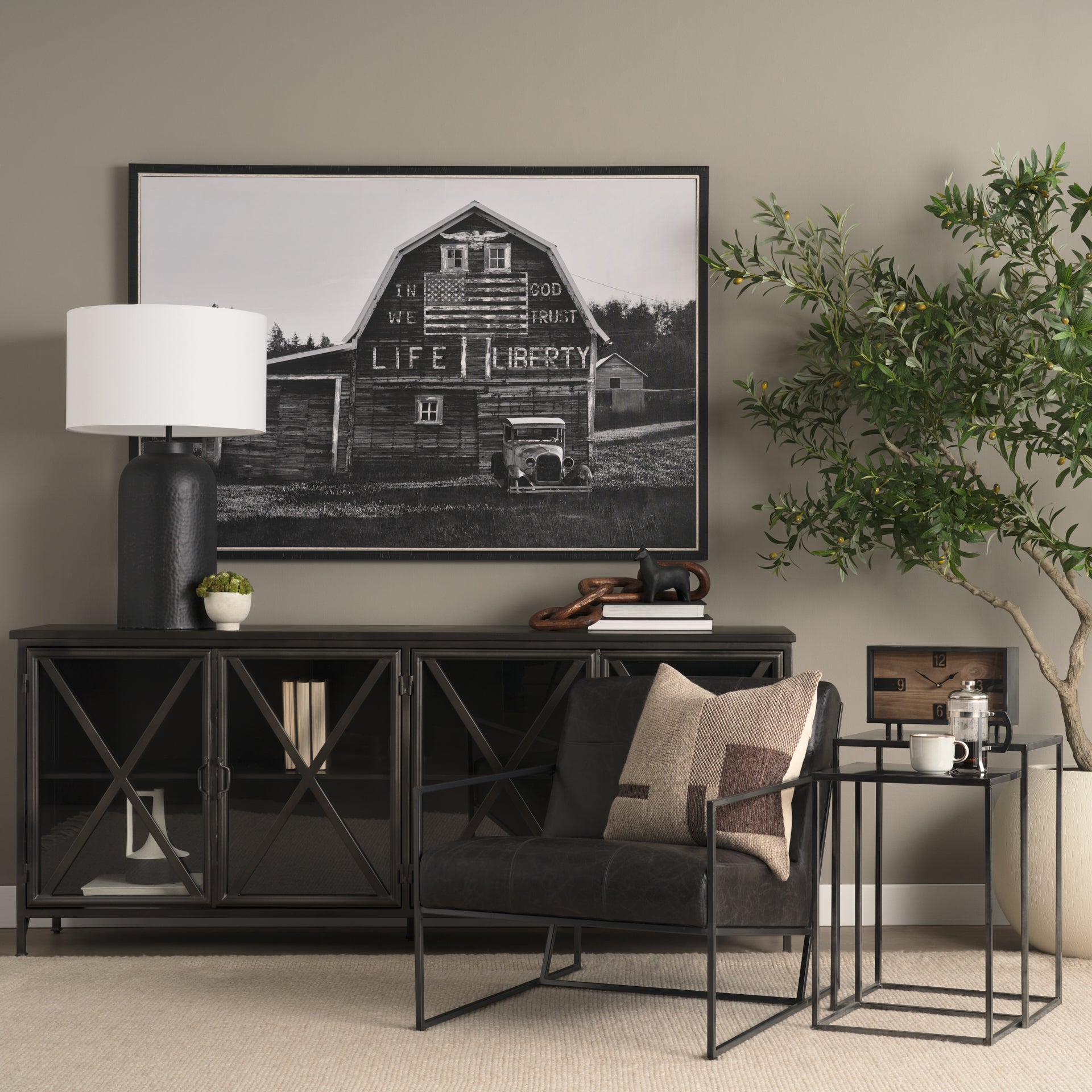 Stratton Gunmetal w/ Genuine Aged Black Leather Upholstered Accent Chair shown from a different angle to reveal its silhouette.