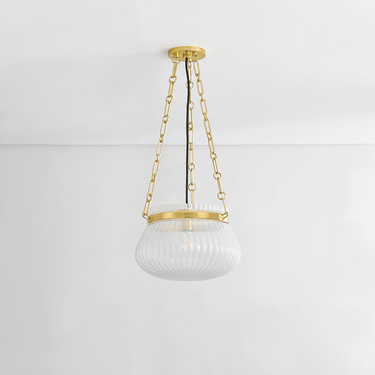 Close-up of the Granby Pendant 13" in aged brass showing the shade shape and metal detail.