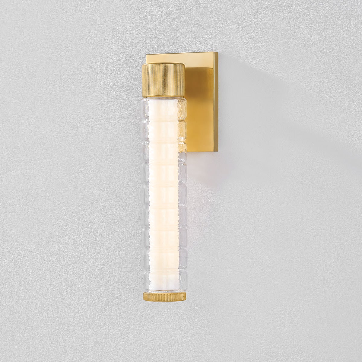 Castor Bath Sconce 4.25" x 13.5" in aged brass shown from the front to reveal the arm spread and shade silhouette.