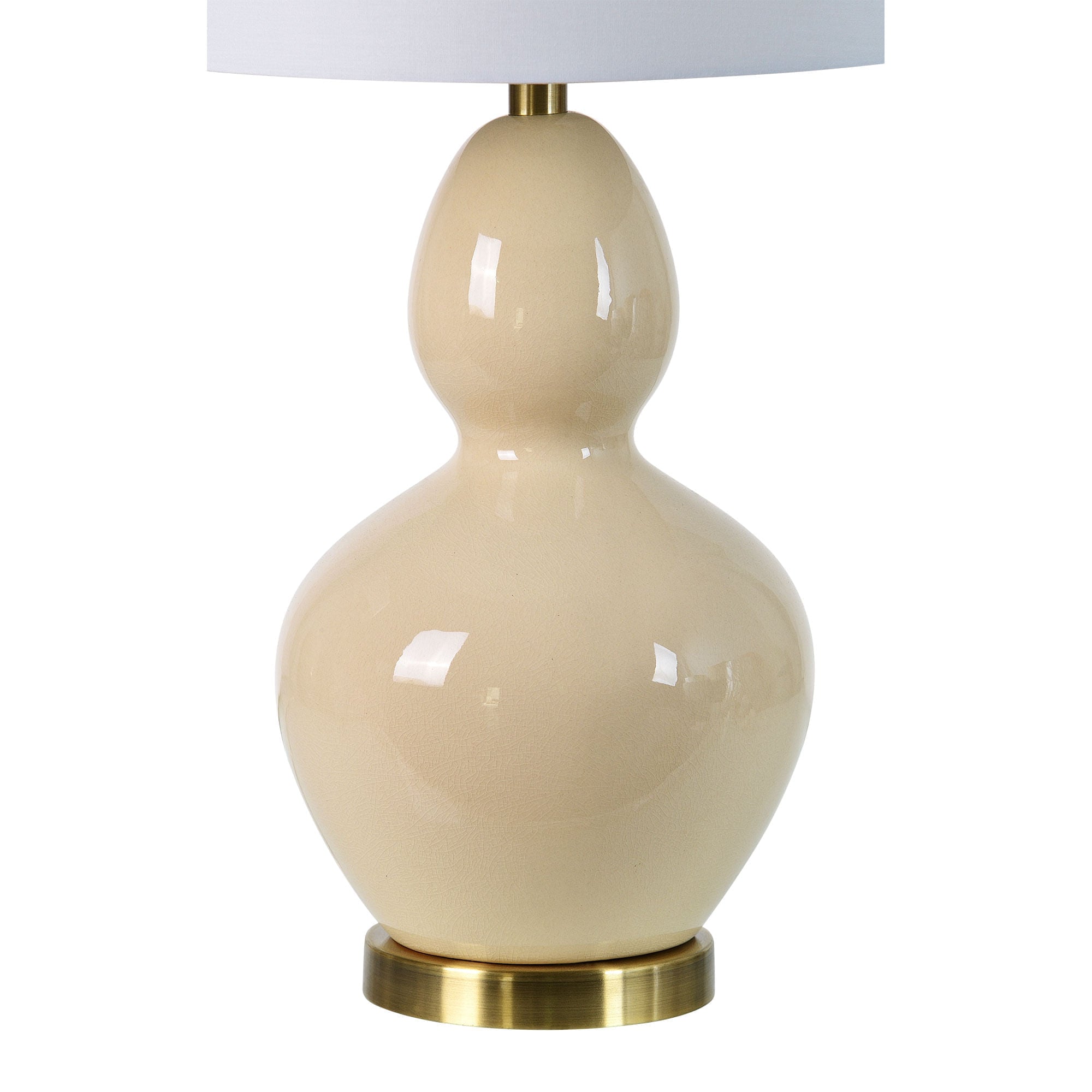 Jesula Table Lamp - close-up of beige ceramic base, glossy finish with brass base and white shade