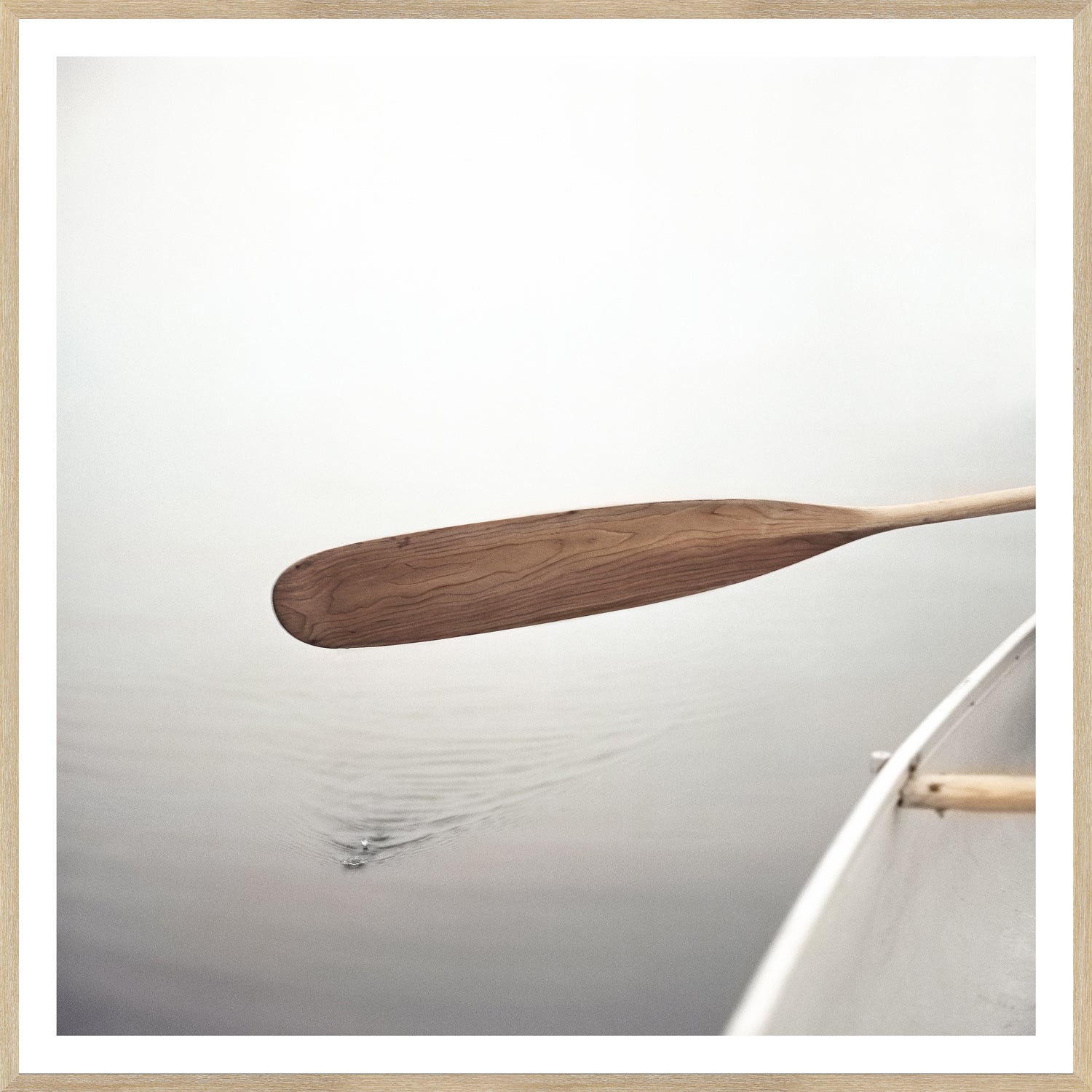 The Paddle wall art showing a wooden paddle over still water