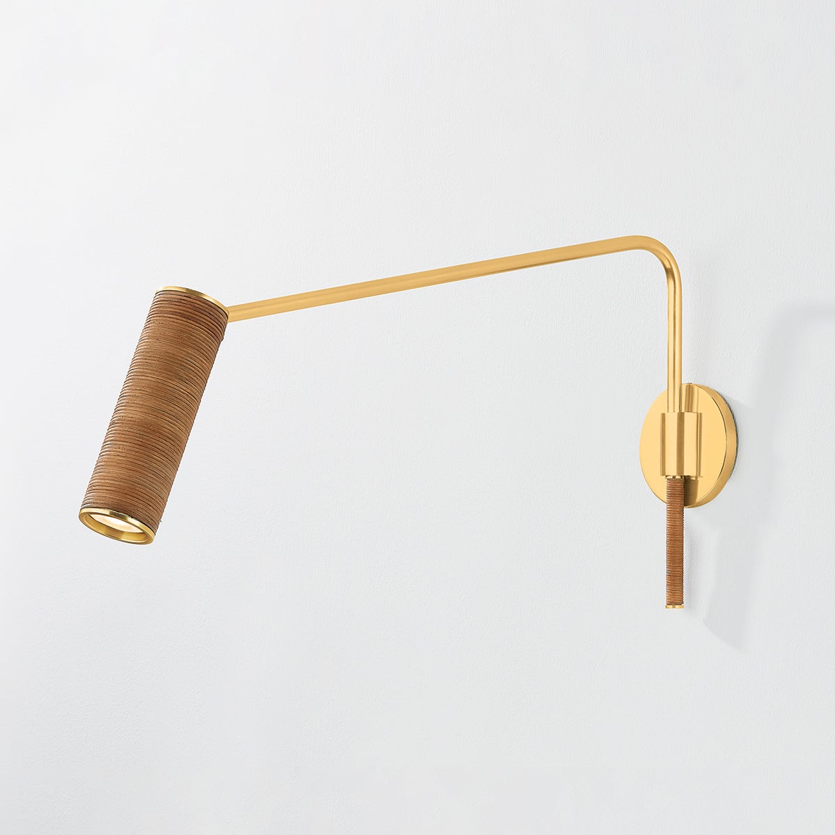 Close-up of the Narragansett Wall Sconce in aged brass showing the arm curve and shade silhouette.