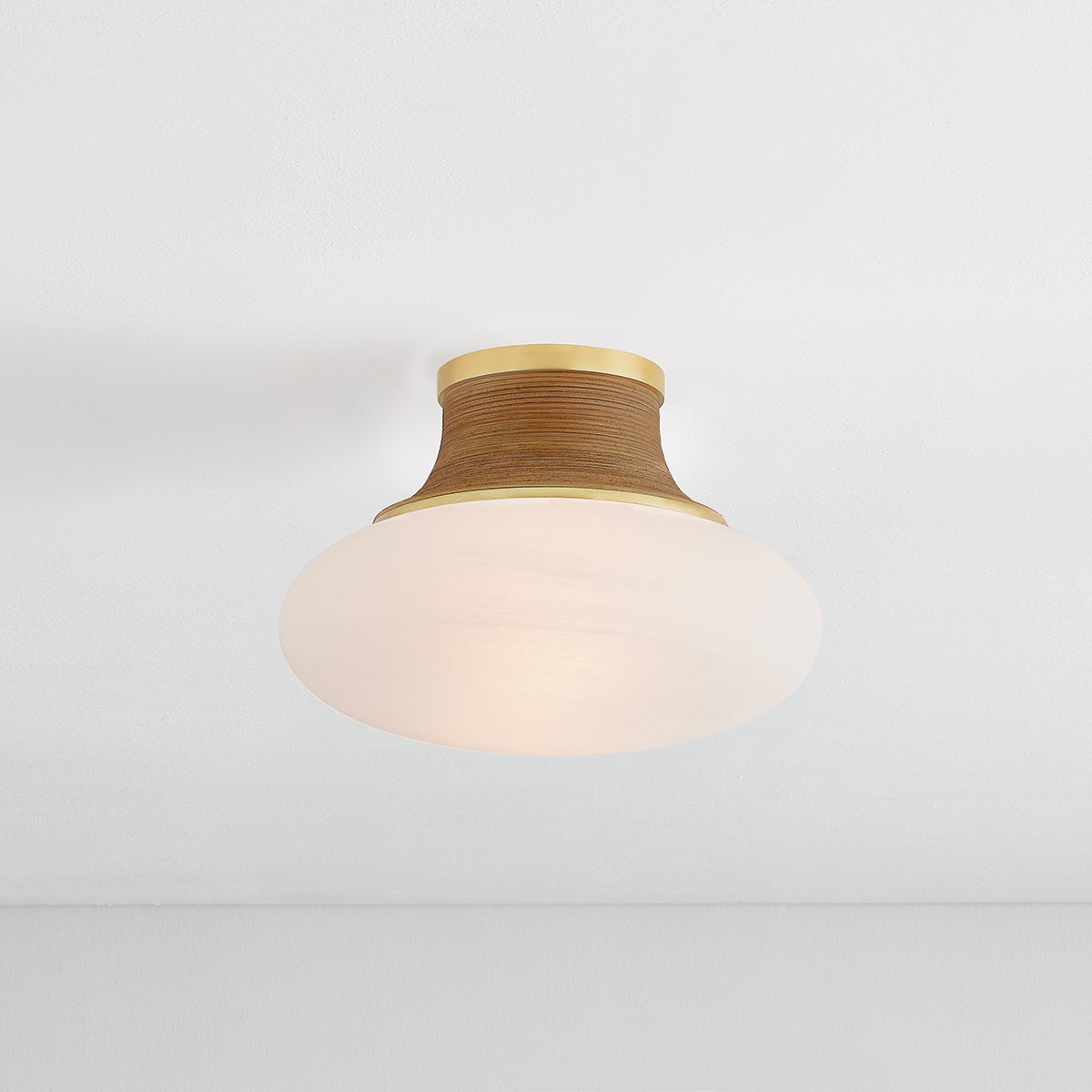 Pearl River Flush Mount 11" in aged brass shown from the front to reveal the shade profile and mounting canopy.