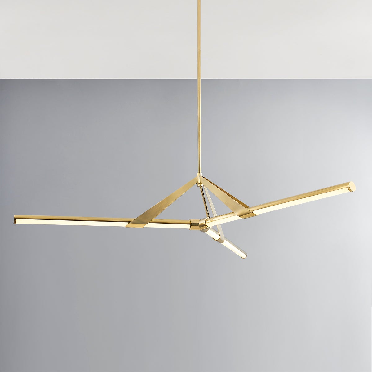 Close-up of the Jonas Chandelier 62.25" in aged brass showing the frame, arms, and shade detail.