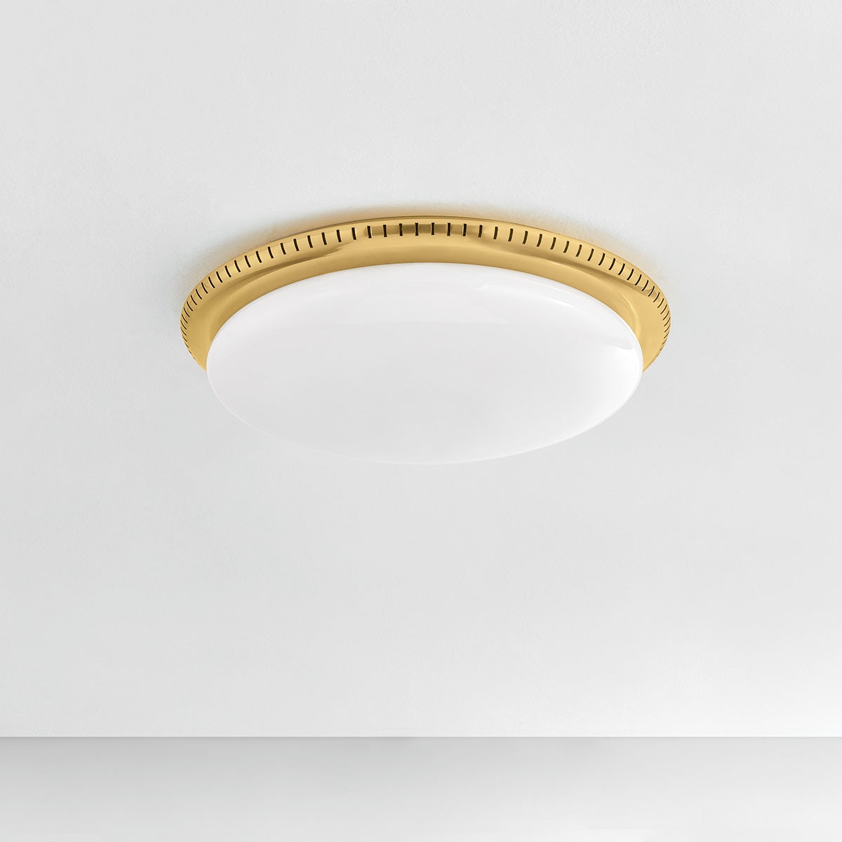 North Castle Flush Mount 18.25" in aged brass shown from a second angle to highlight the shade profile and mounting canopy.