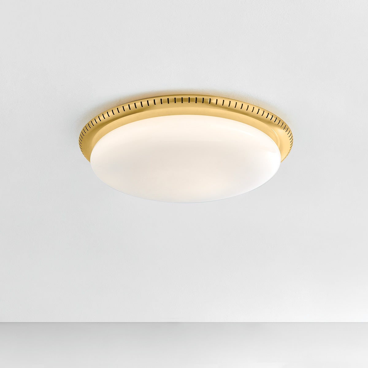 North Castle Flush Mount 18.25" in aged brass shown from the front to reveal the shade profile and mounting canopy.