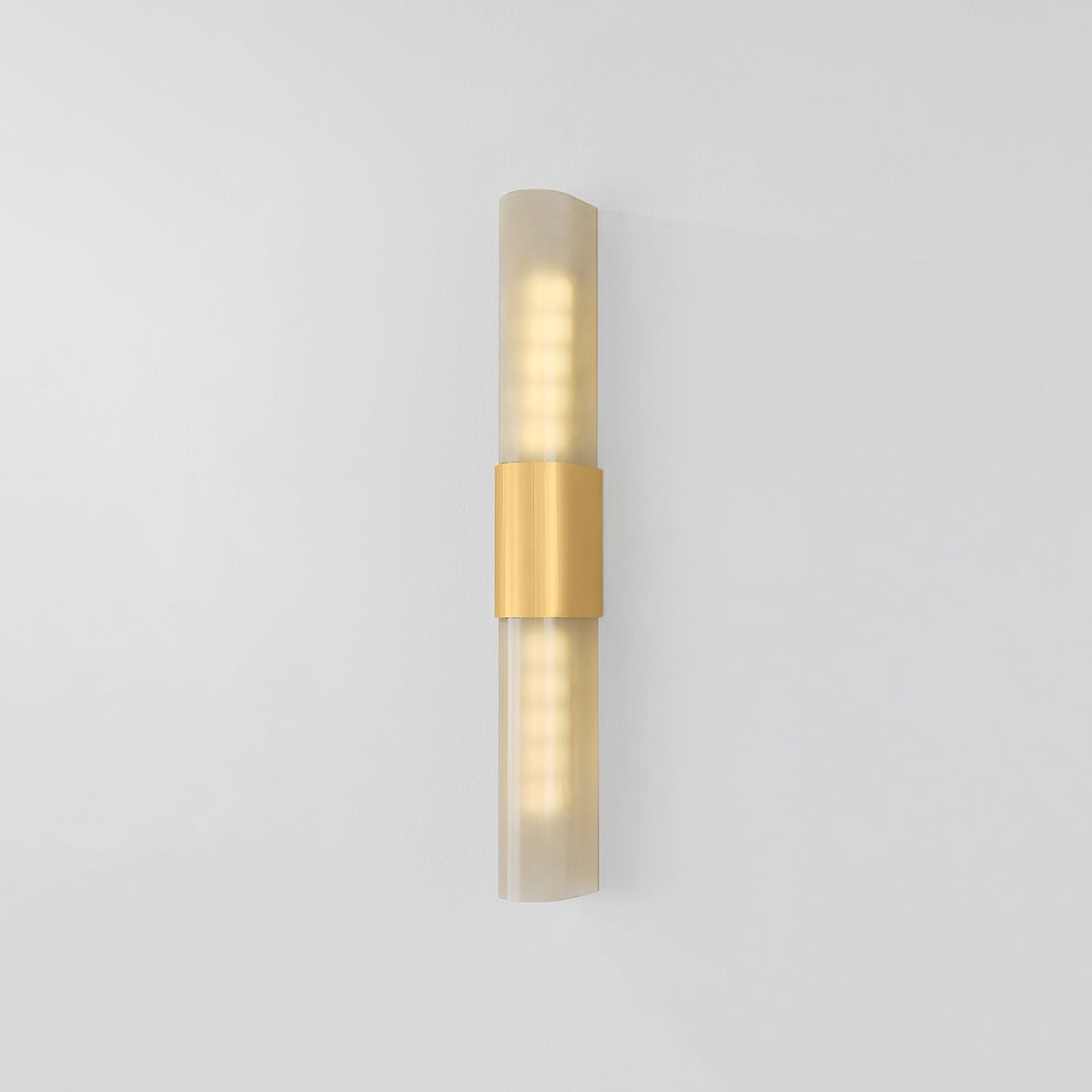 Somersville Wall Sconce 3.25" x 27.25" in aged brass shown from the front to reveal the arm curve and shade silhouette.
