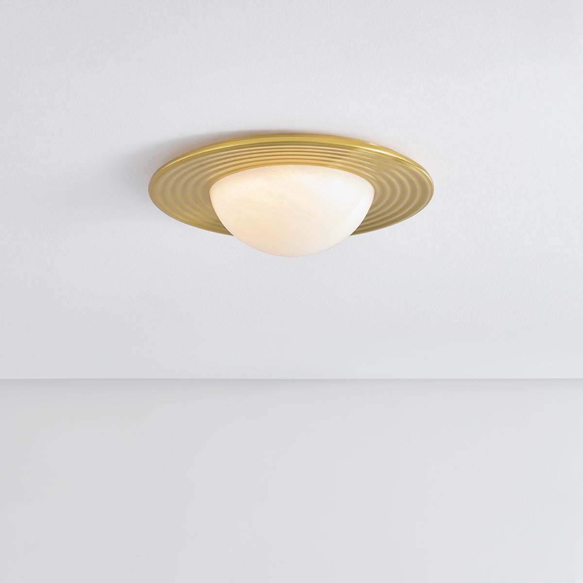 Close-up of the Geraldton Flush Mount 15.75" in aged brass showing the shade profile and mounting canopy.