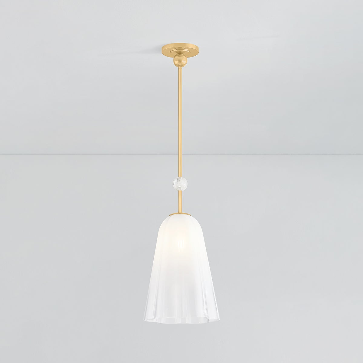 Cambria Heights Pendant in aged brass shown from the front to reveal the shade shape and metal detail.