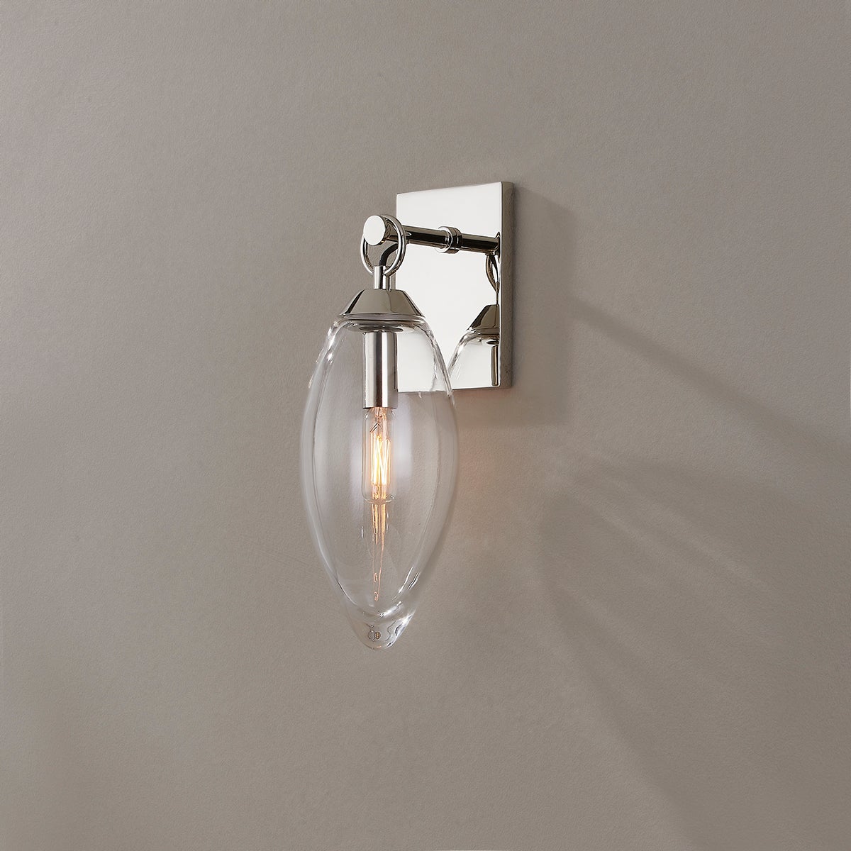 Close-up of the Nantucket Wall Sconce in polished nickel showing the arm curve and shade silhouette.