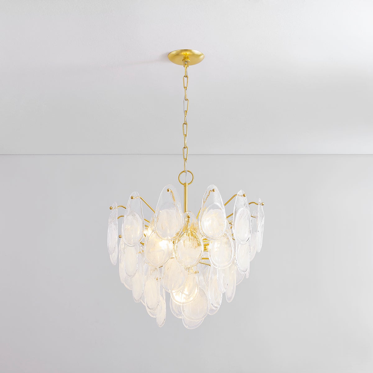 Close-up of the Darcia Chandelier 24" in aged brass showing the frame, arms, and shade detail.