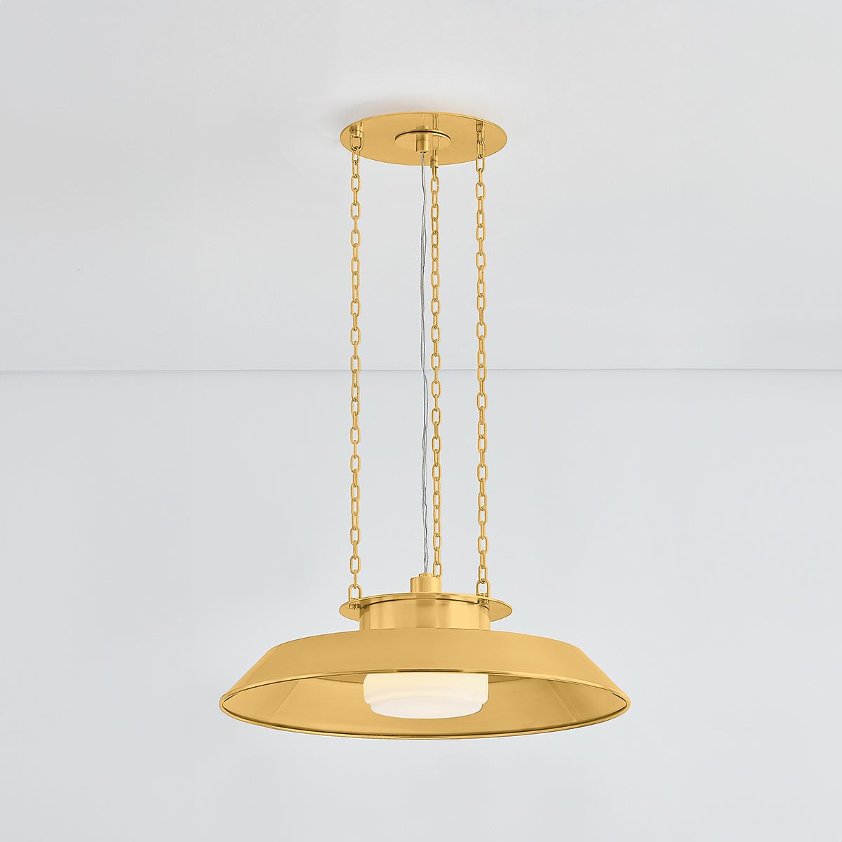 Close-up of the Woodrow Pendant 22" in aged brass showing the shade shape and metal detail.