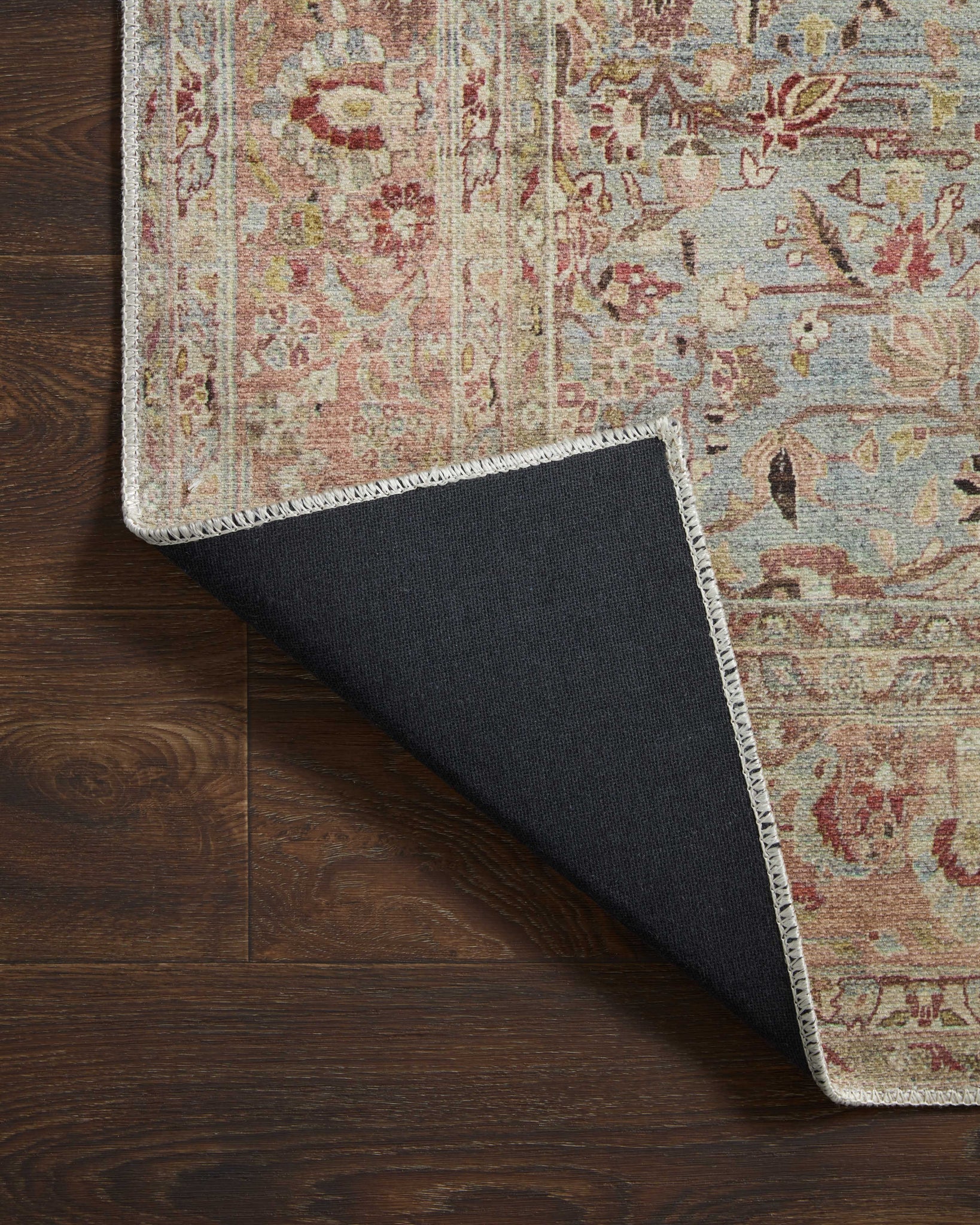 Adrian Ocean / Clay styled underfoot in a layered living room at Laurie Yapp Home.