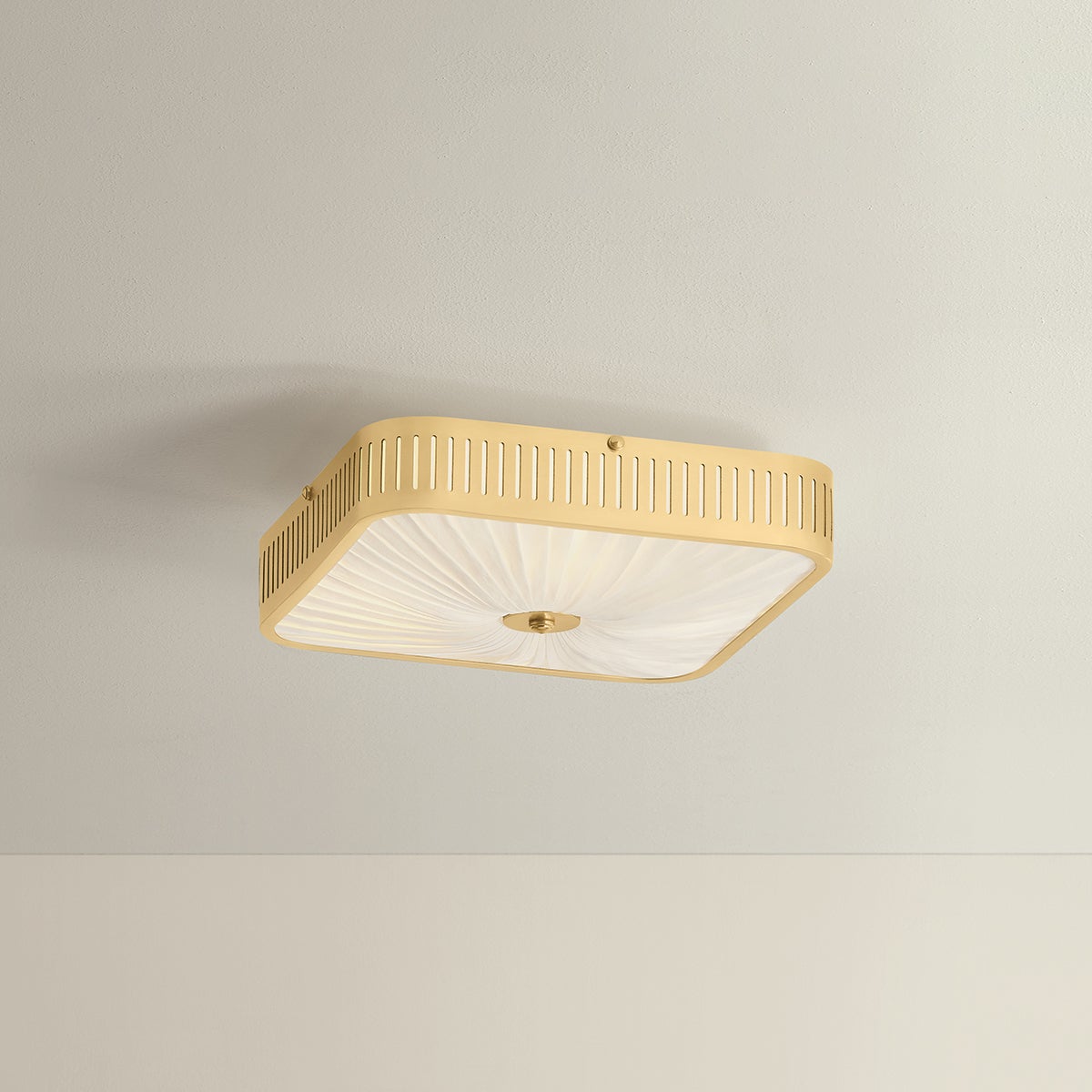 Henri Semi Flush 14.5" in aged brass shown from the front to reveal the shade profile and mounting canopy.