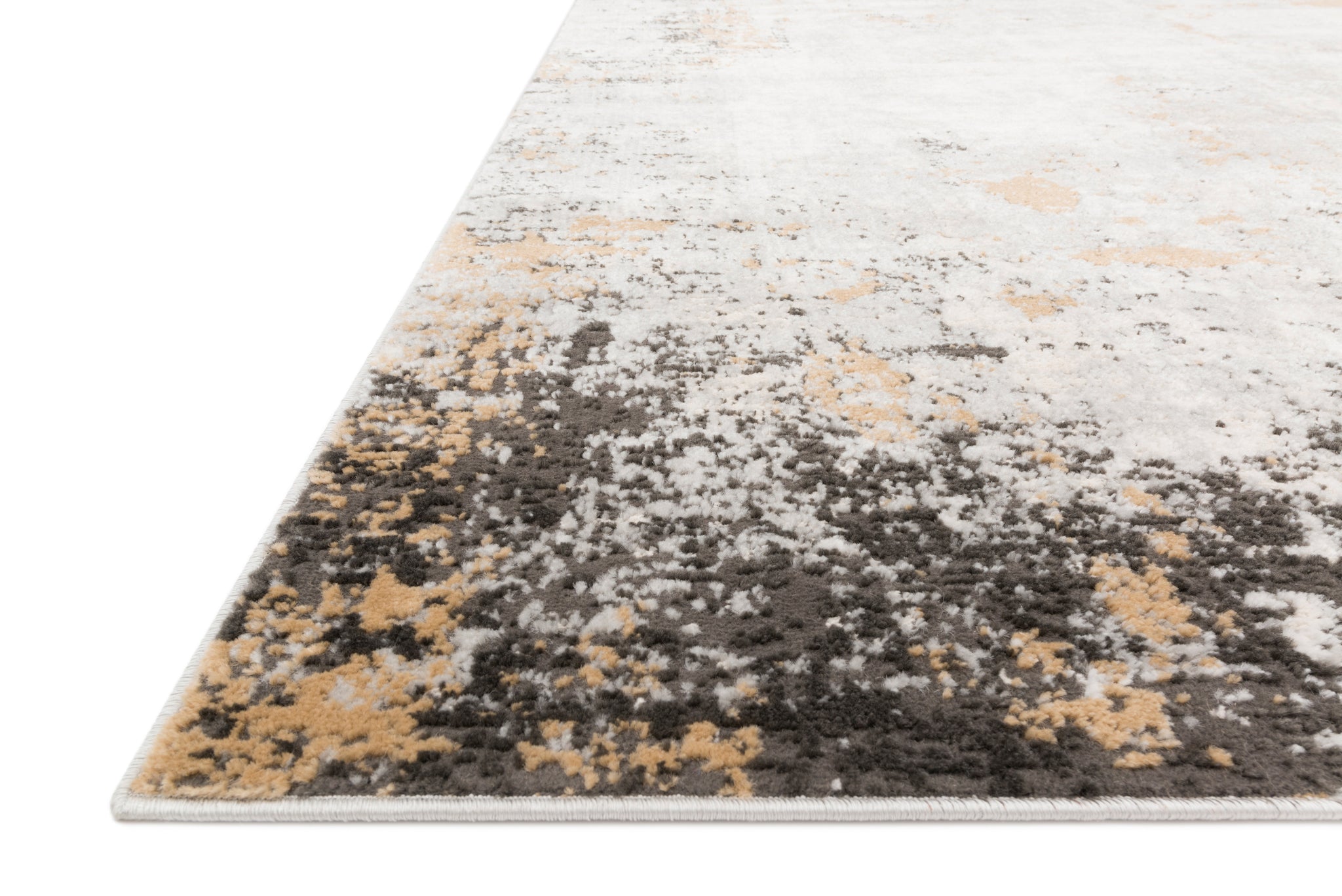 Alchemy Granite / Gold shown in a curated living room setting at Laurie Yapp Home.