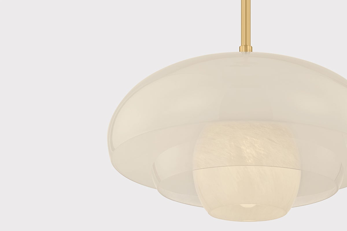 Close-up of the Auburndale Pendant in aged brass showing the shade shape and metal detail.