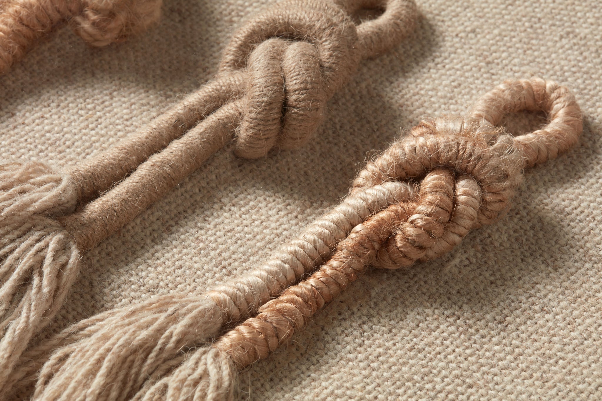 Twisted Beige / Brown Rug Art shown from a different angle to reveal its pattern.