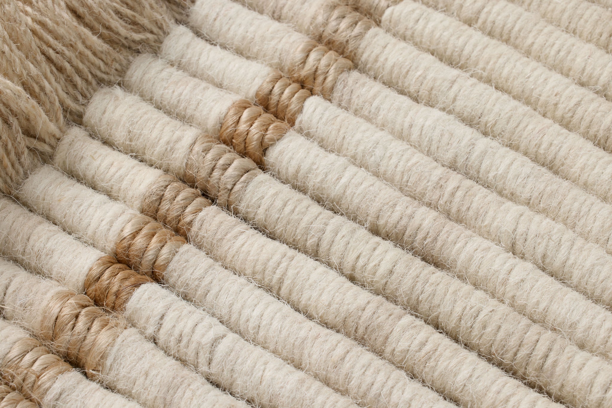 All Coiled Up Ivory / Natural Rug Art shown from a different angle to reveal its pattern.