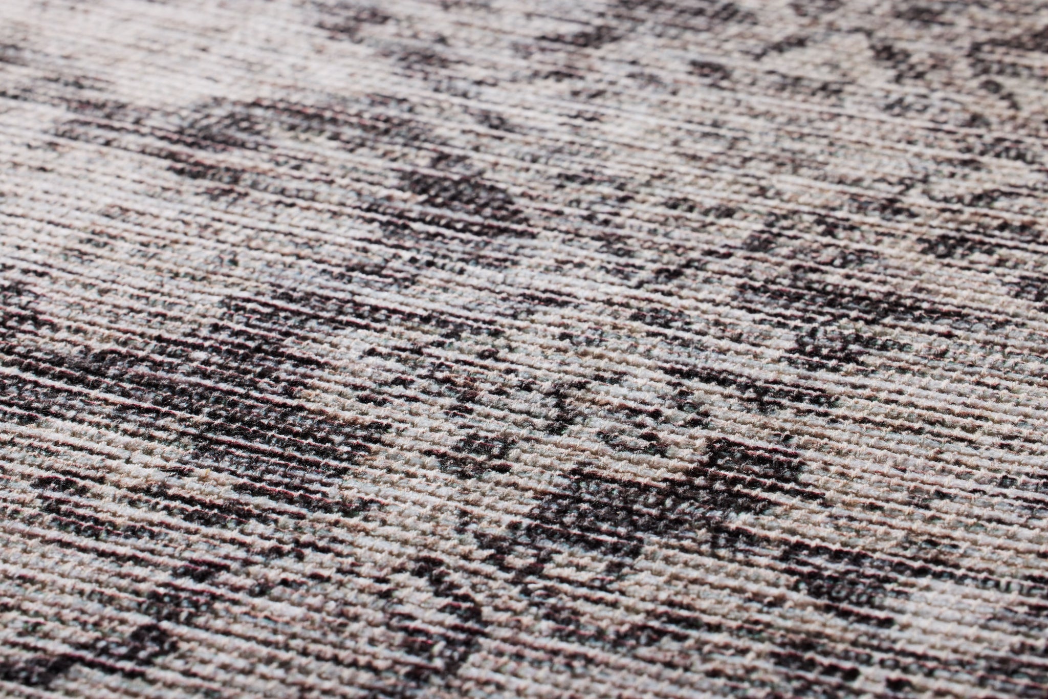 Scidrus Black / Grey Rug Art shown from a different angle to reveal its pattern.