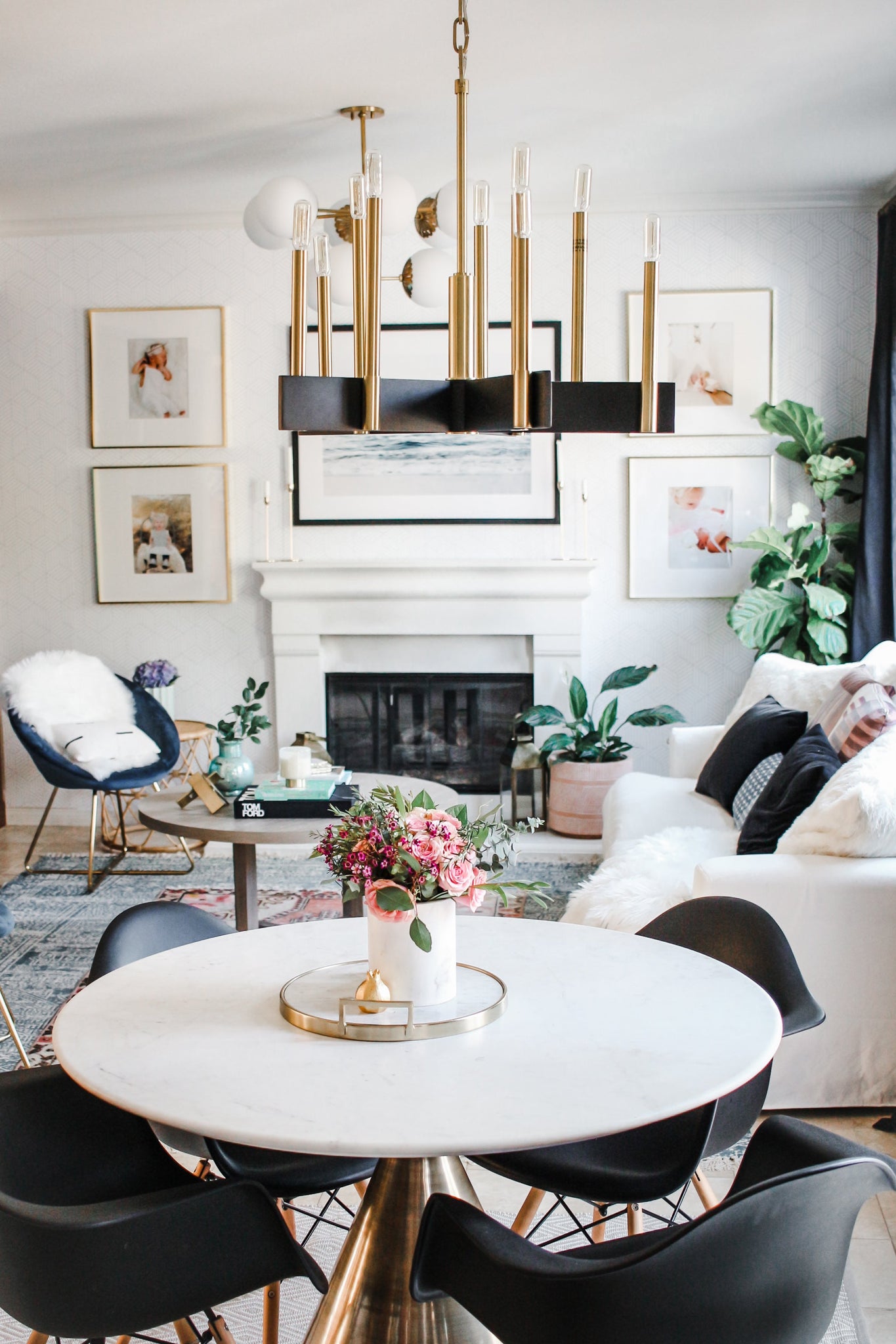 Abrams Chandelier 24.75" in aged brass styled in a two-story entry for warm, layered light at Laurie Yapp Home.