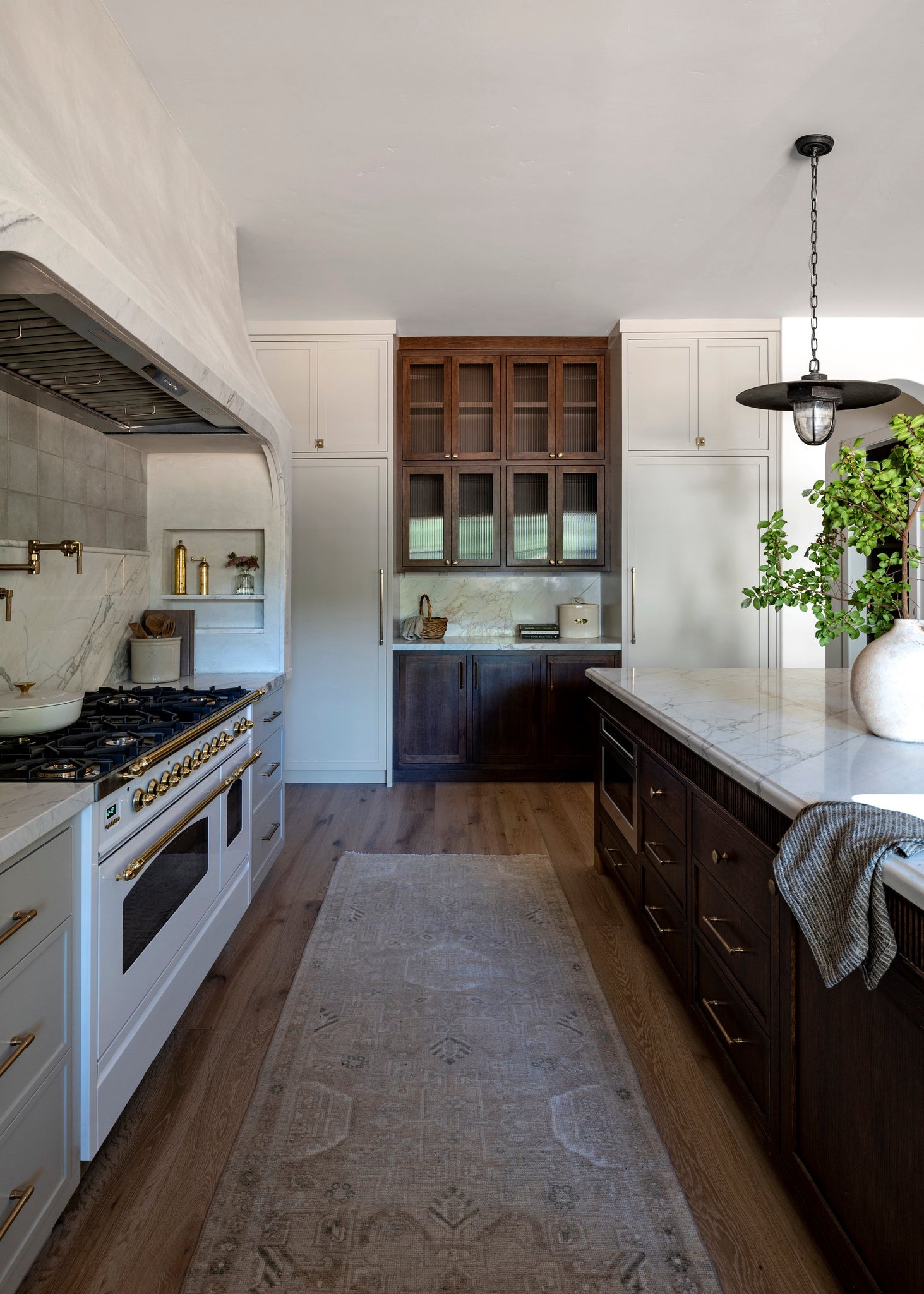 Acme Pendant 22" styled in a welcoming entryway for warm, layered light at Laurie Yapp Home.