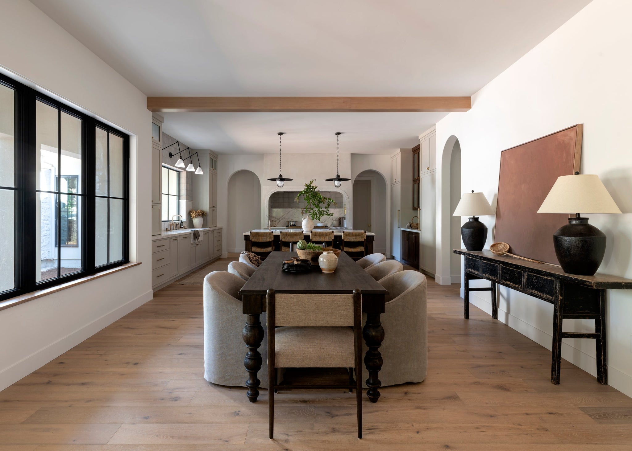 Acme Pendant 22" styled in an elegant dining room for warm, layered light at Laurie Yapp Home.