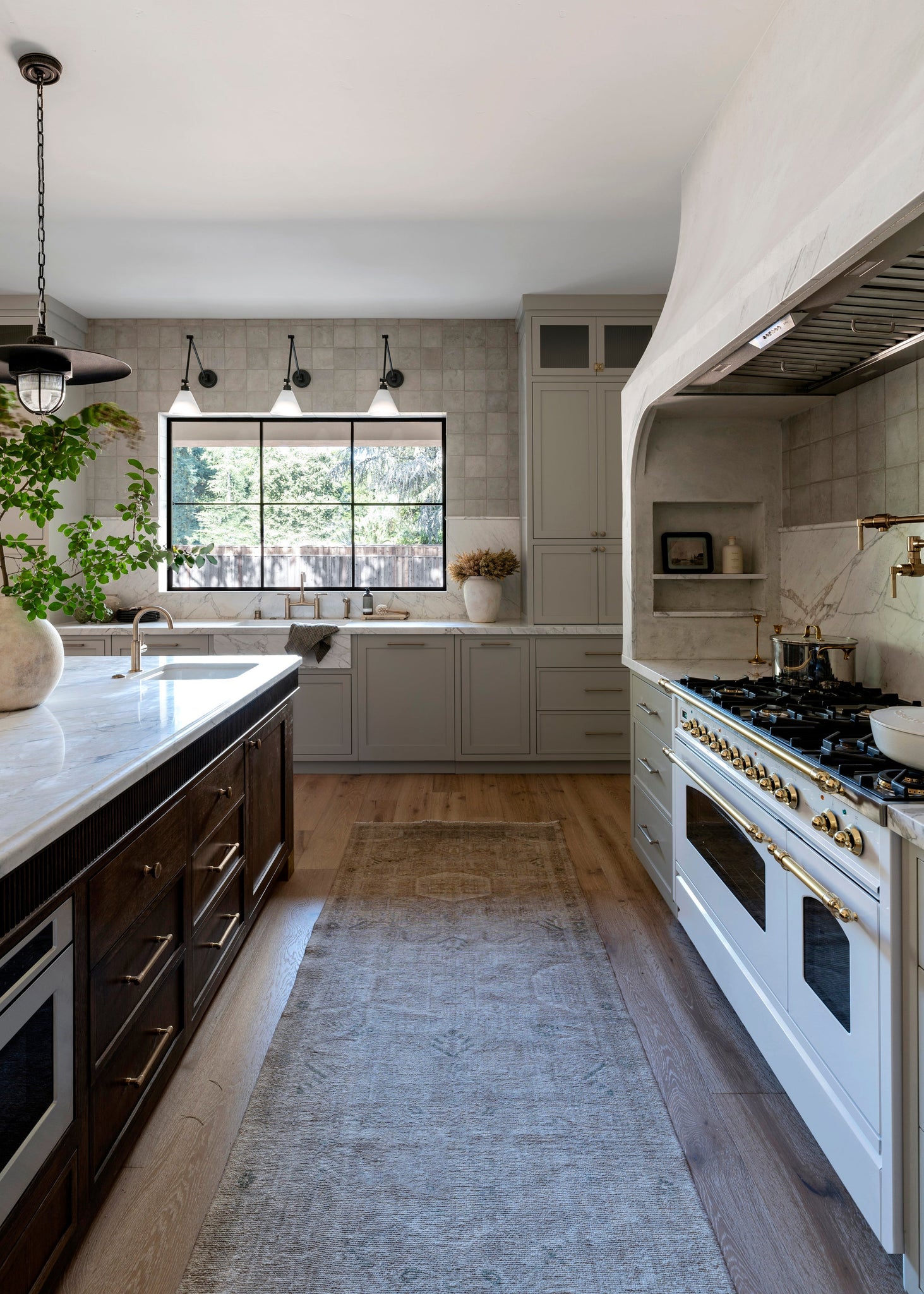 Acme Pendant 22" styled in a bright kitchen for warm, layered light at Laurie Yapp Home.