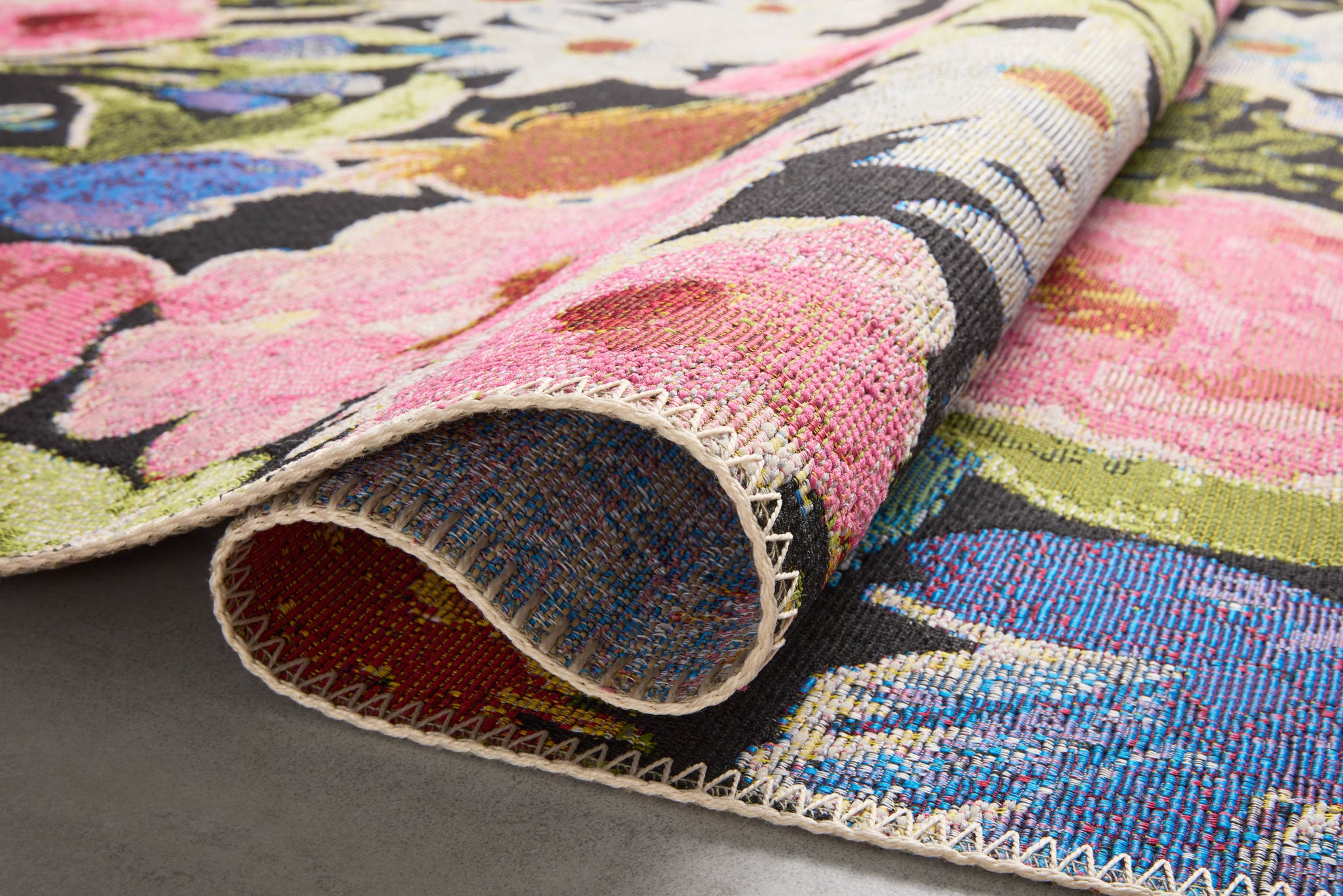 Close-up detail of the Botanical Black / Multi showing its pile and weave.