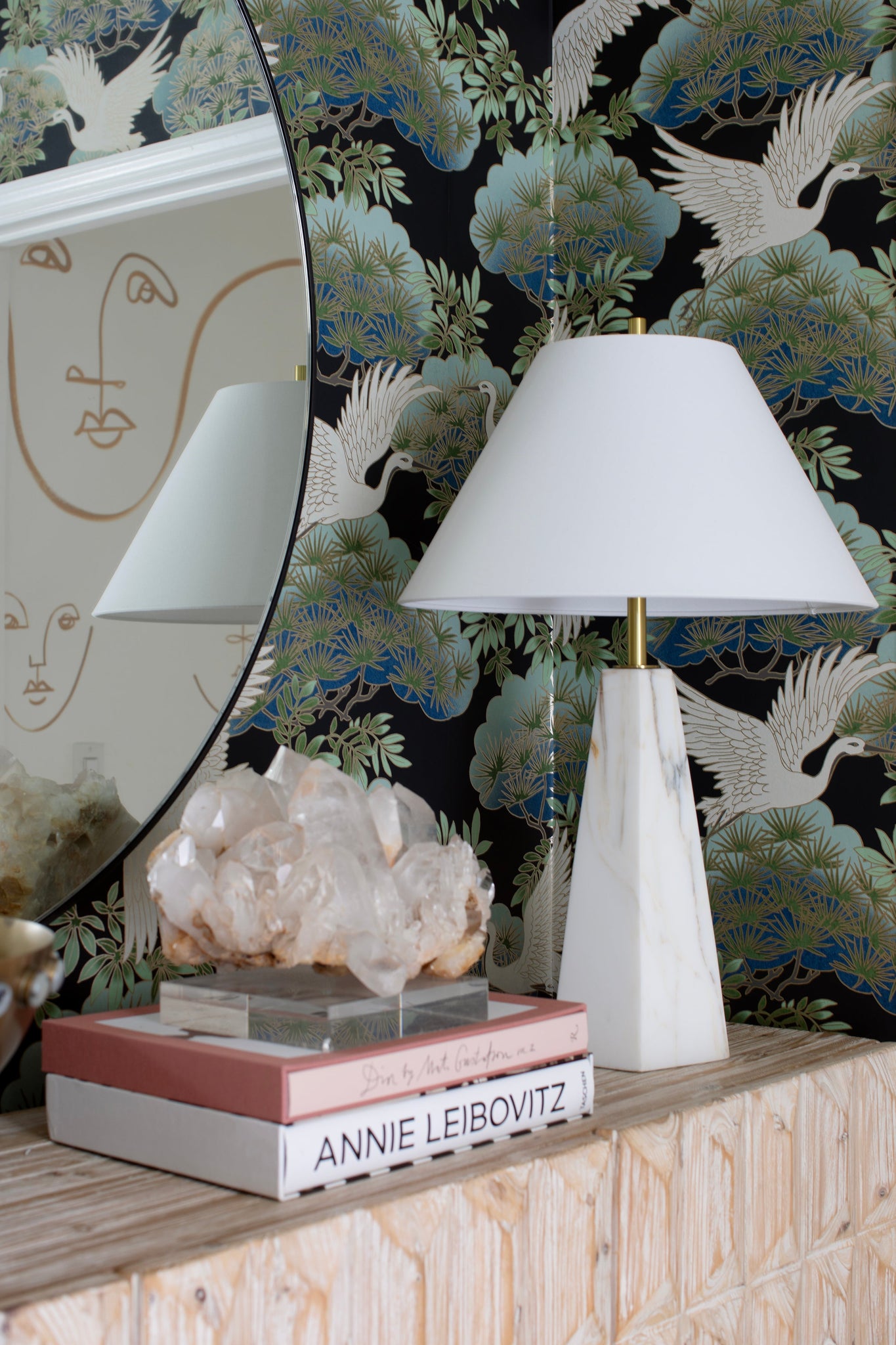 Benicia Table Lamp in aged brass styled in a bedroom nightstand for warm, layered light at Laurie Yapp Home.