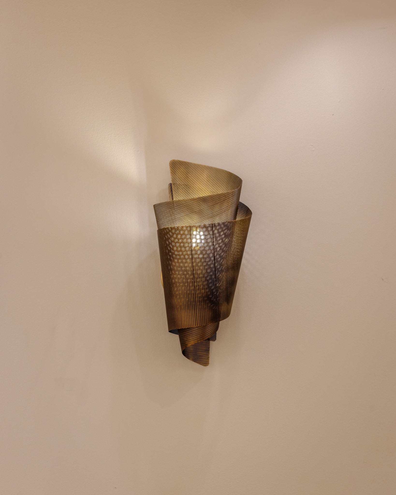 Blaisdell Wall Sconce styled in a curated living room for warm, layered light at Laurie Yapp Home.