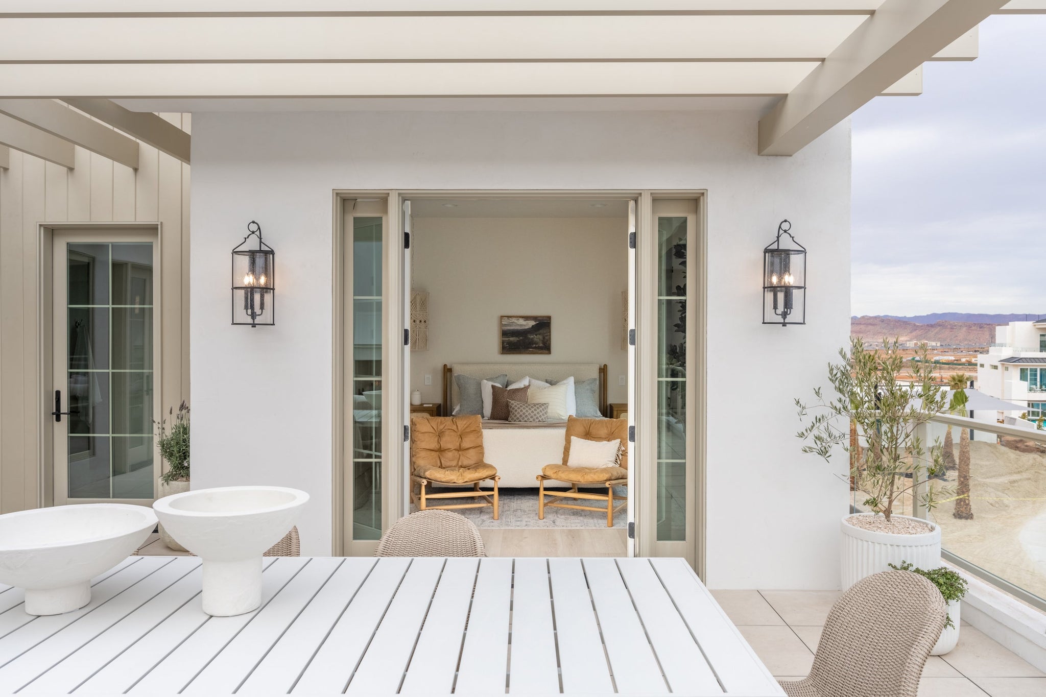 Burbank Exterior Wall Sconce 10" styled in a modern bathroom for warm, layered light at Laurie Yapp Home.