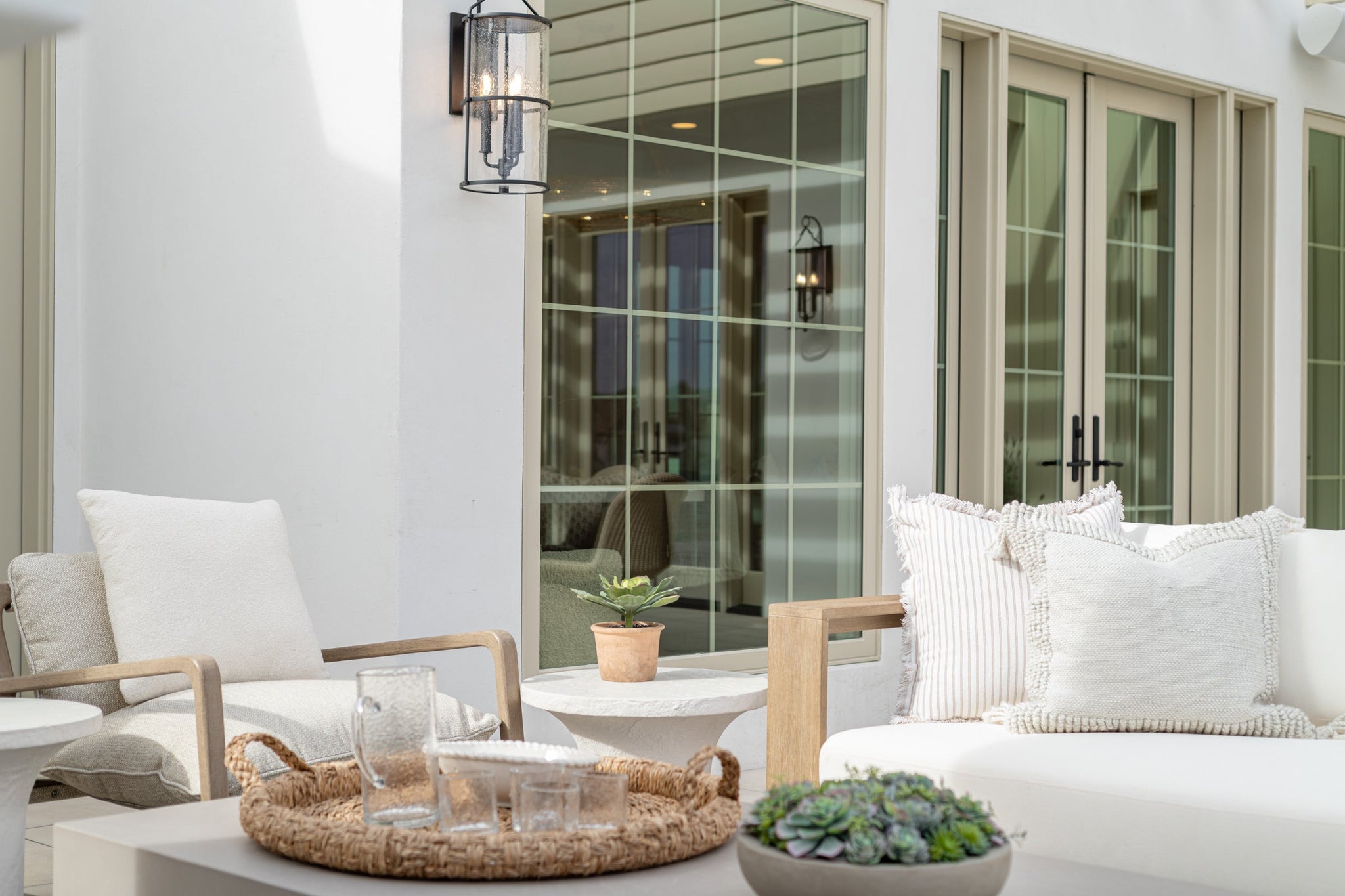 Burbank Exterior Wall Sconce 10" styled in a warmly lit hallway for warm, layered light at Laurie Yapp Home.