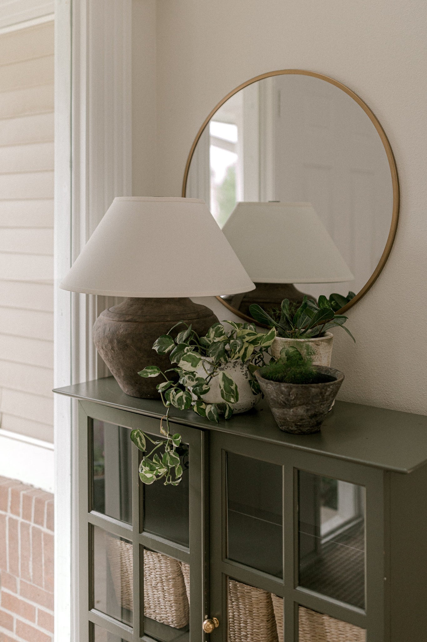 Calabria Table Lamp 20" styled in a curated console for warm, layered light at Laurie Yapp Home.