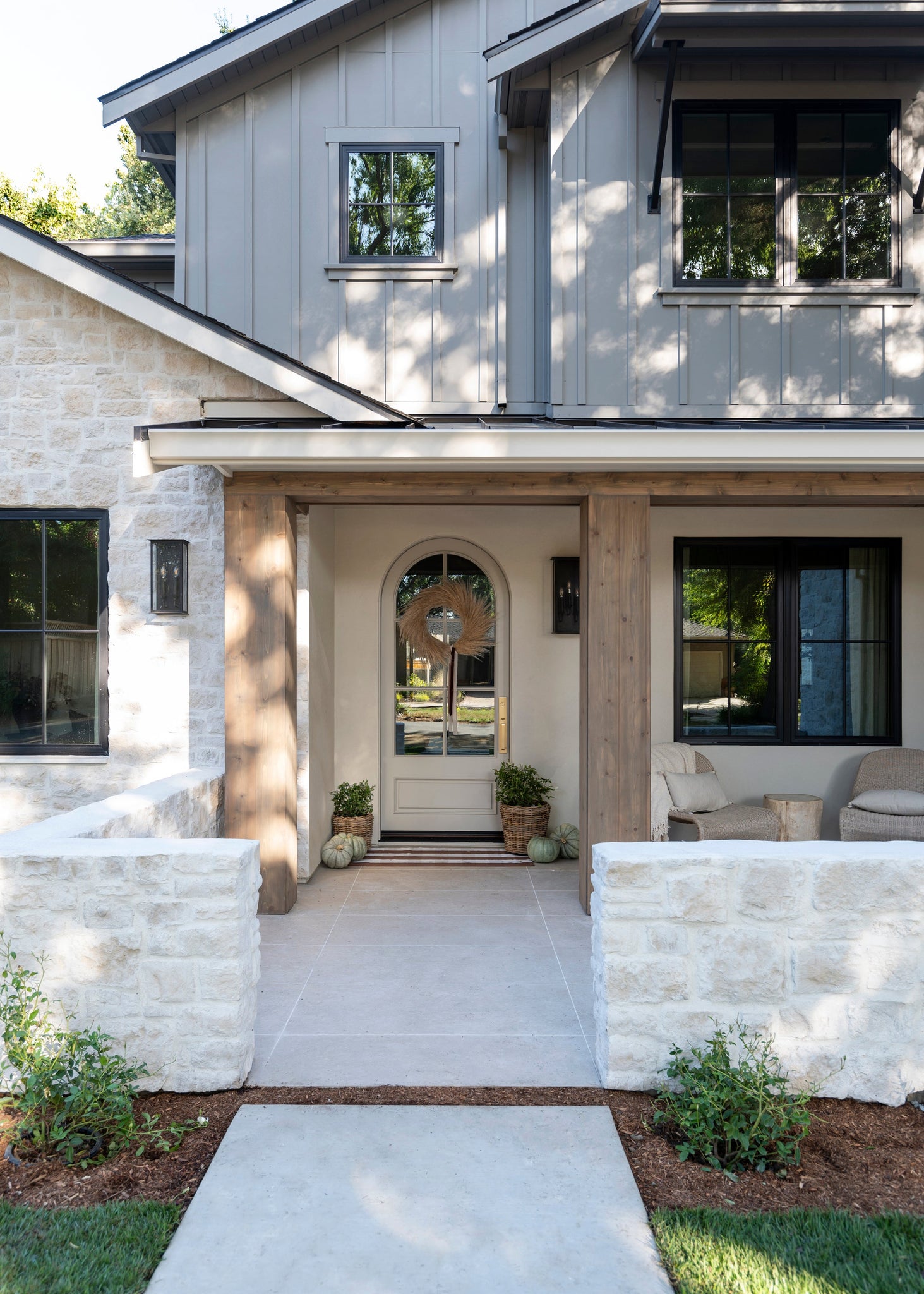 Chauncey Exterior Wall Sconce 9.5" x 19" styled in a curated living room for warm, layered light at Laurie Yapp Home.