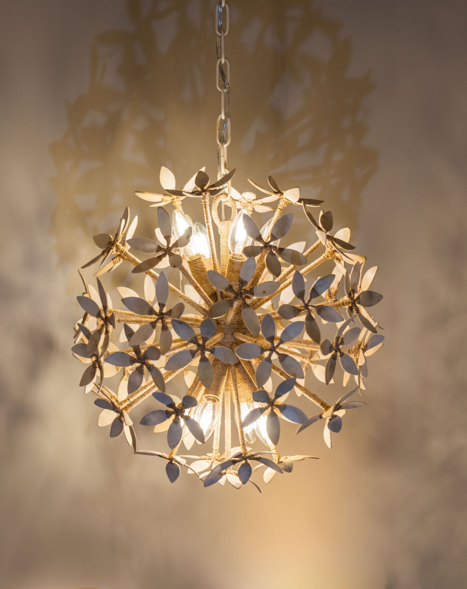 Corfu Chandelier 20" styled in an elegant dining room for warm, layered light at Laurie Yapp Home.