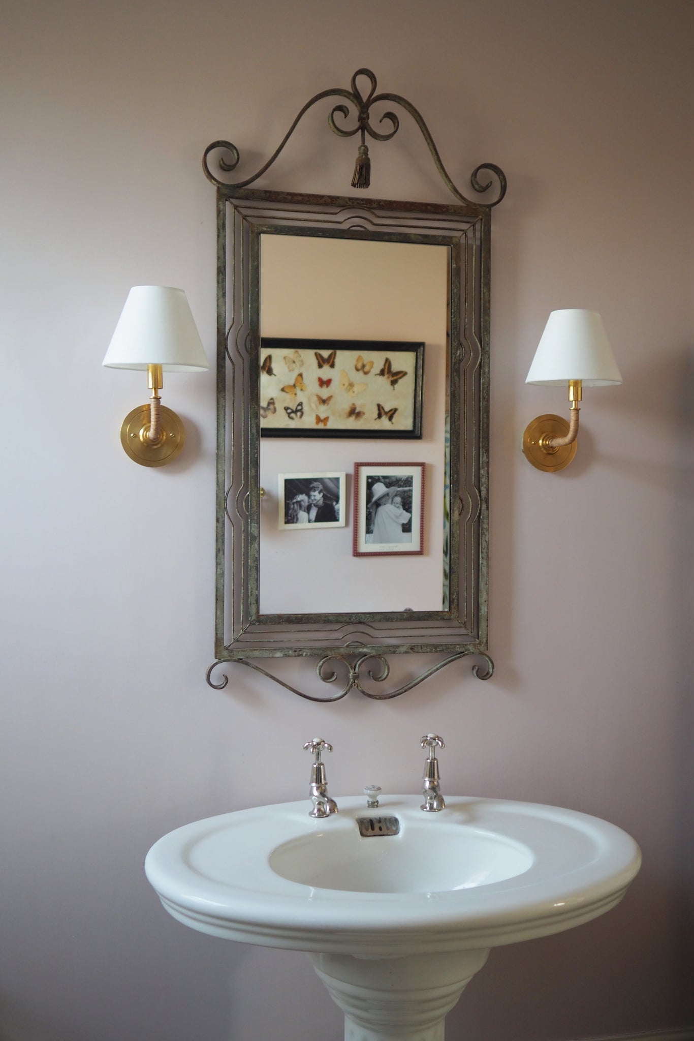 Close-up of the Curves No.1 Wall Sconce in aged brass showing the arm curve and shade silhouette.