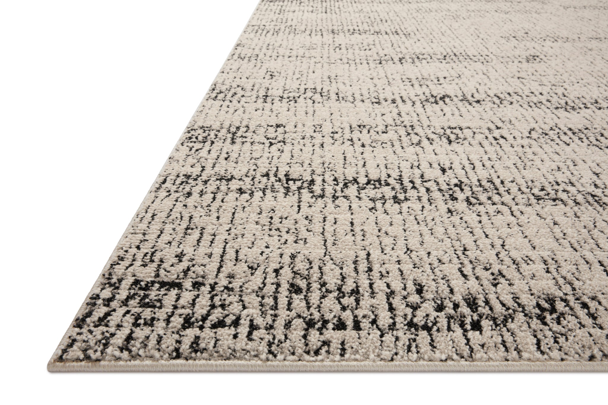 Side view of the Darby Oatmeal / Charcoal rug.