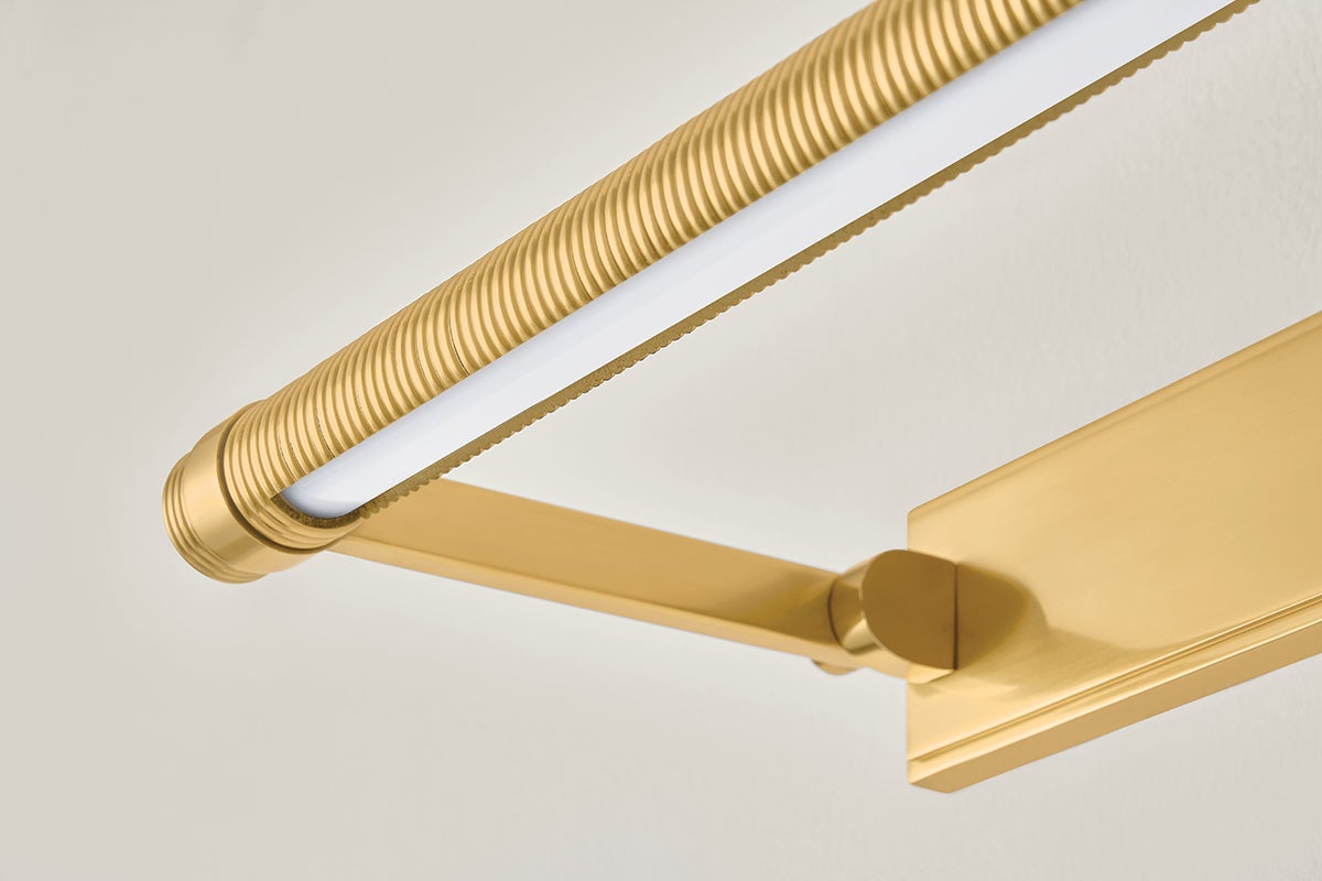 Close-up of the Duell Picture Light 18" in aged brass showing the arm curve and shade proportion.