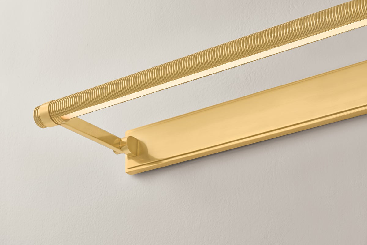 Close-up of the Duell Picture Light 30" in aged brass showing the arm curve and shade proportion.