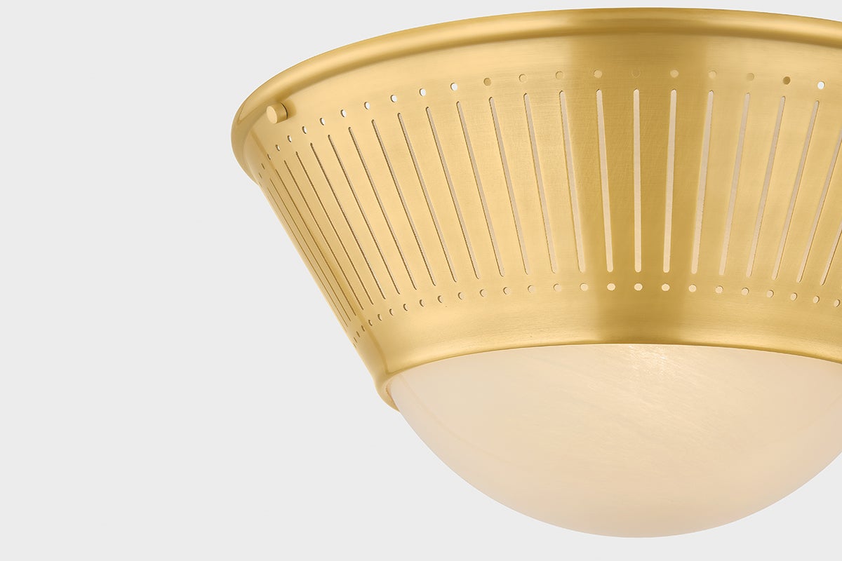 Close-up of the Elsmere Flush Mount in aged brass showing the shade profile and mounting canopy.