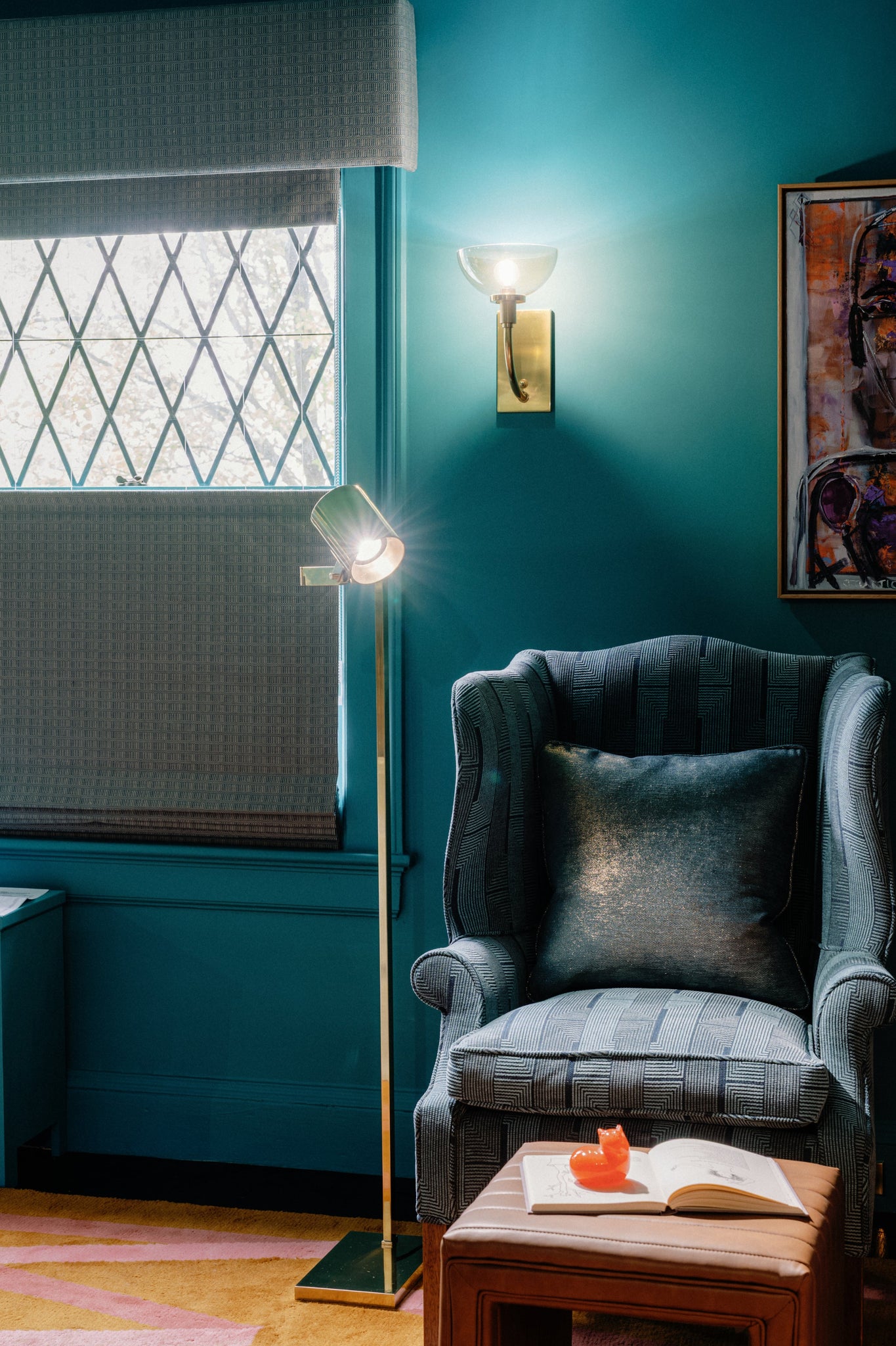 Highgrove Floor Lamp 7" in aged brass styled in a reading nook for warm, layered light at Laurie Yapp Home.
