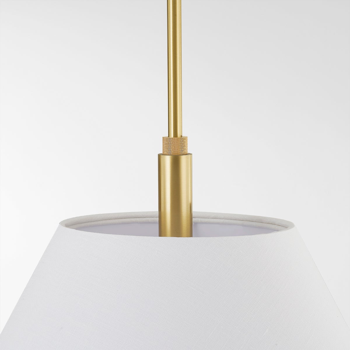 Glenmoore Pendant in aged brass shown from the front to reveal the shade shape and metal detail.