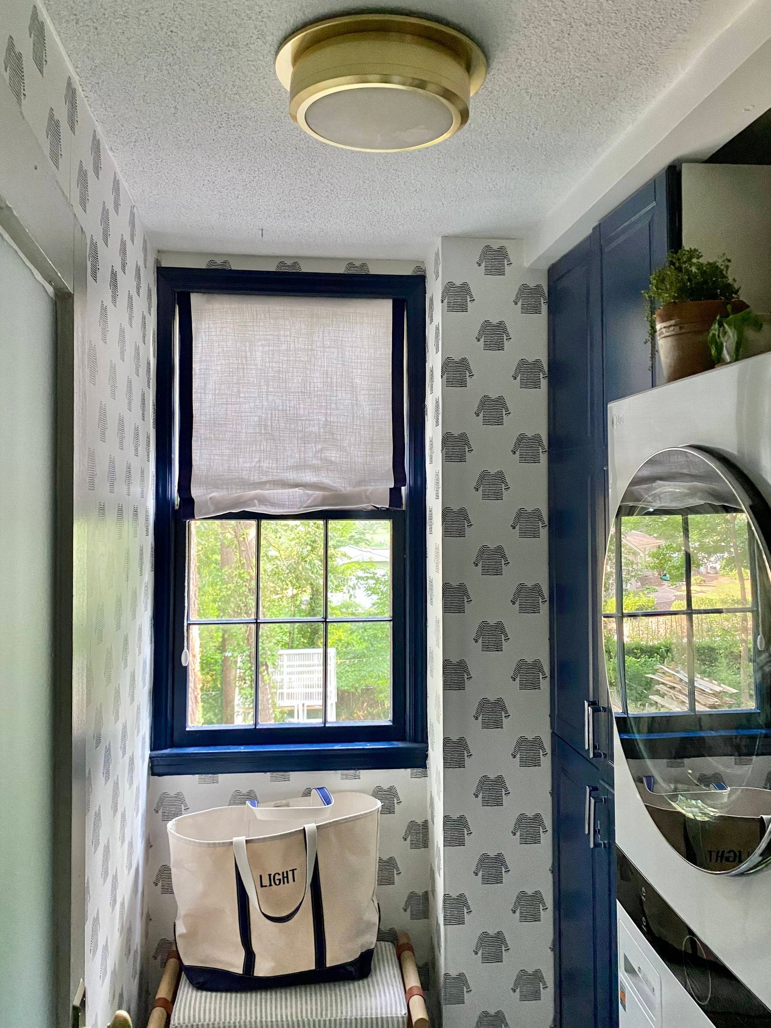 Greenport Flush Mount 14" in aged brass styled in an entryway for warm, layered light at Laurie Yapp Home.