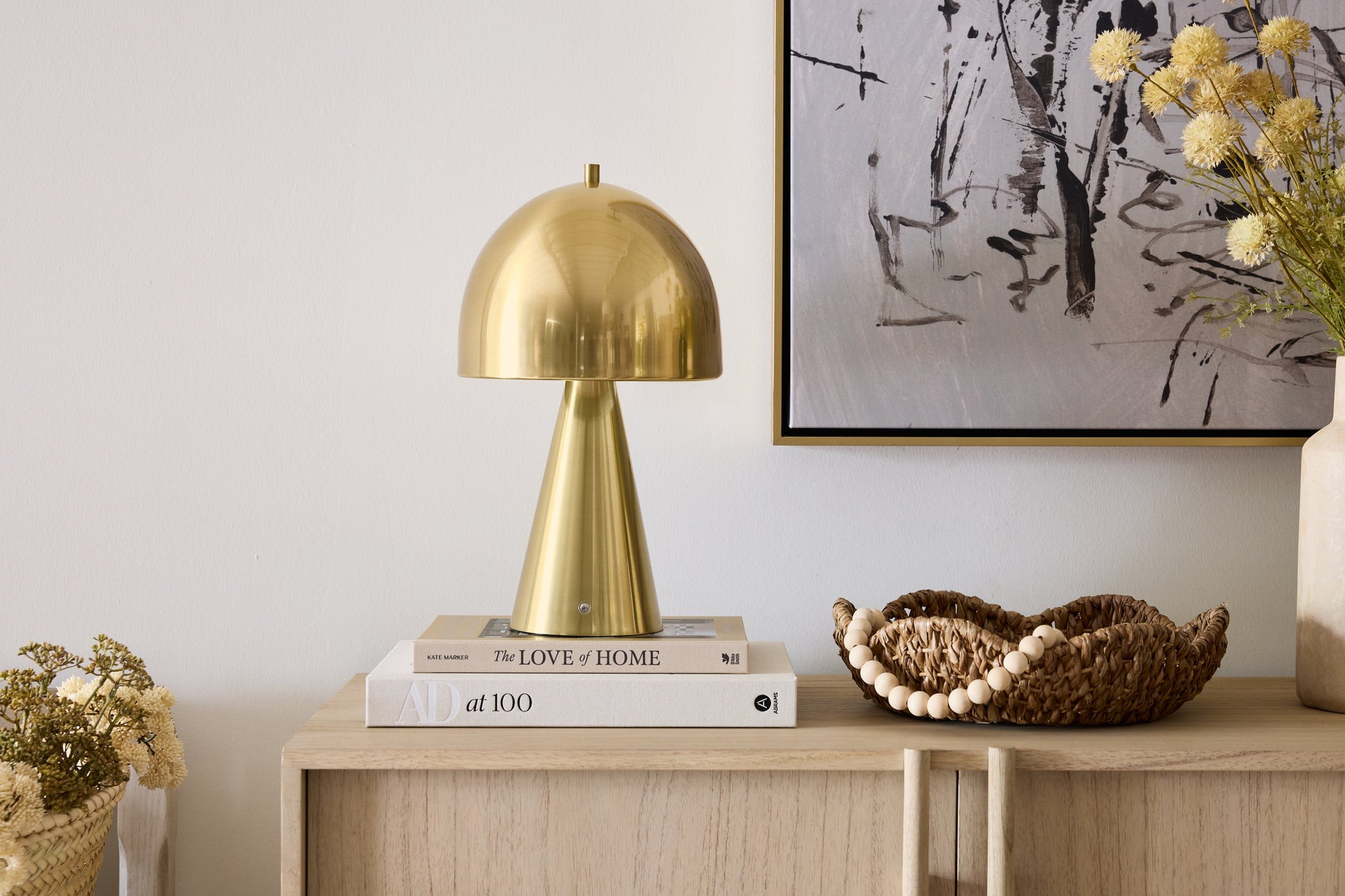 Hopkinton Rechargeable Table Lamp in aged brass styled in a curated interior for warm, layered light at Laurie Yapp Home.