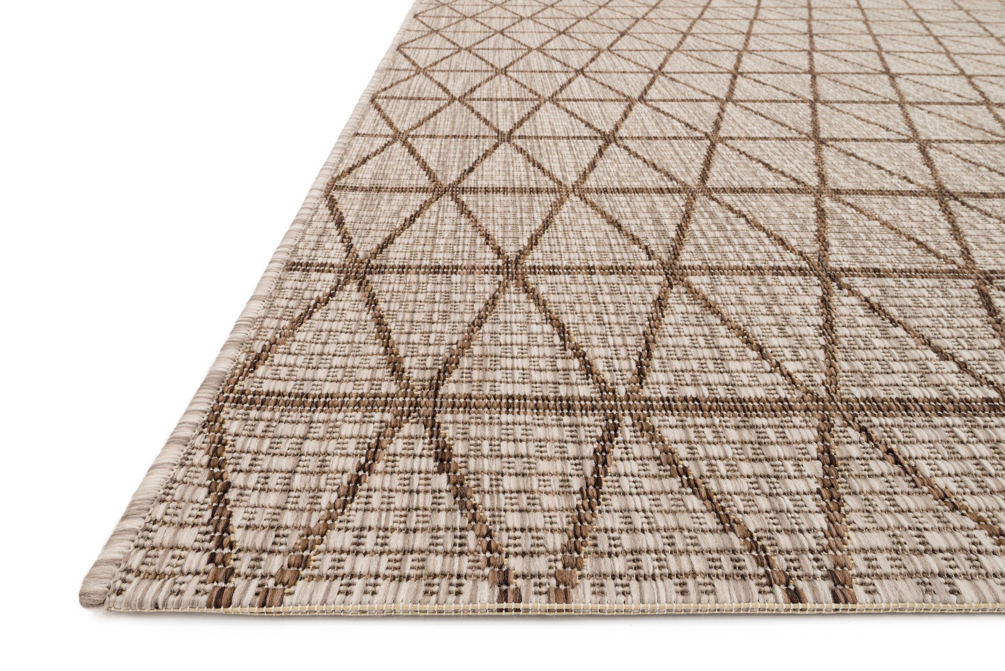 Side view of the Isle Beige / Mocha rug.