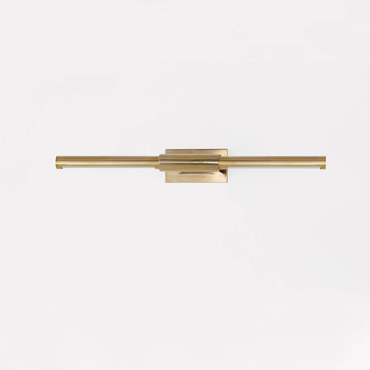 Jerome Picture Light 22.25" in aged brass shown from the front to reveal the arm curve and shade proportion.