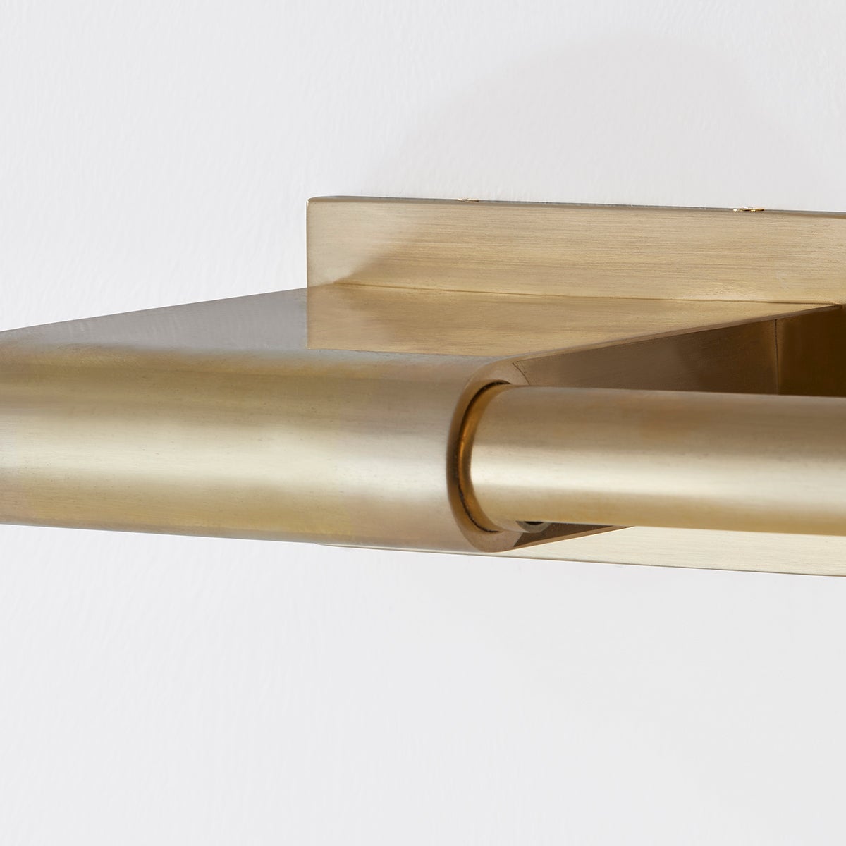 Close-up of the Jerome Picture Light 22.25" in aged brass showing the arm curve and shade proportion.