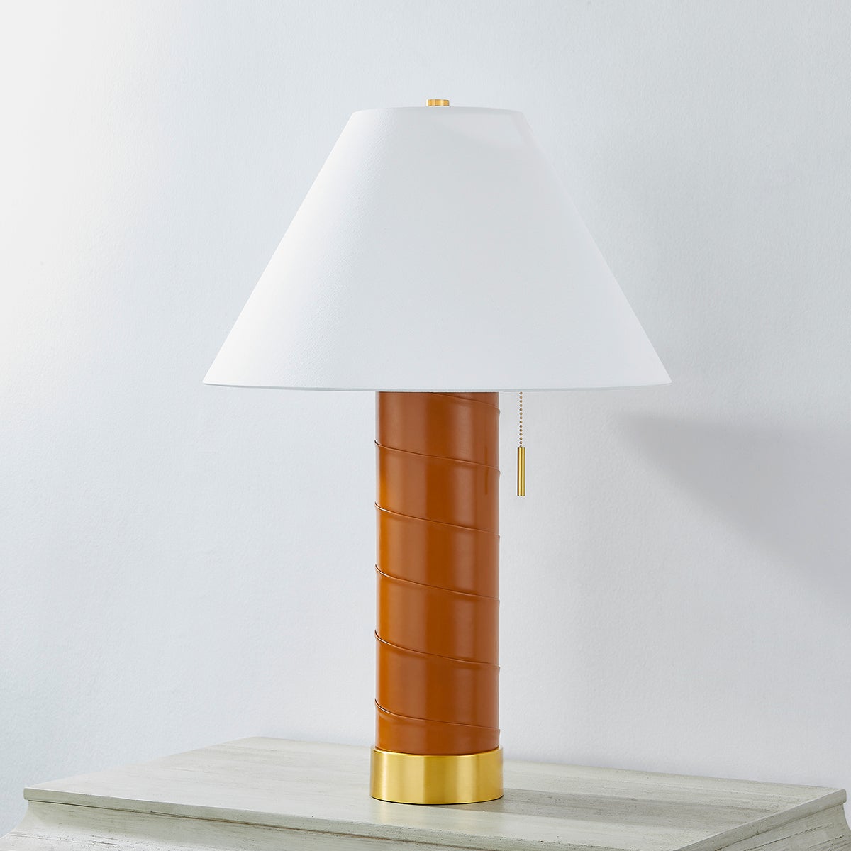 Norwalk Table Lamp in aged brass shown from the front to reveal the base and shade proportions.